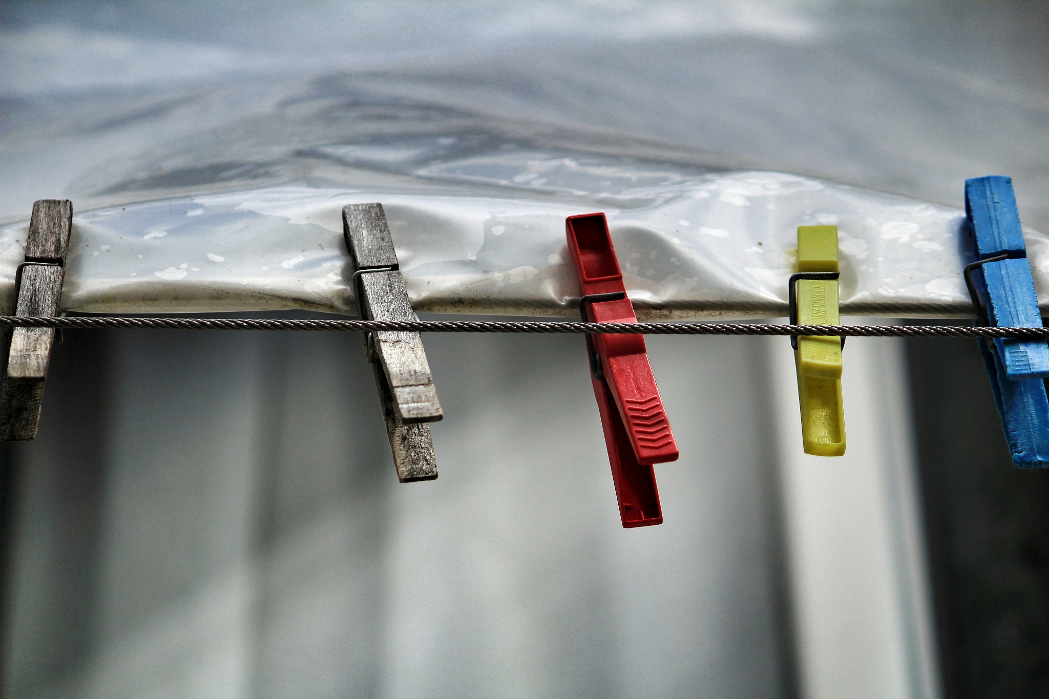 colored clothespins on a clothesline in lisbon