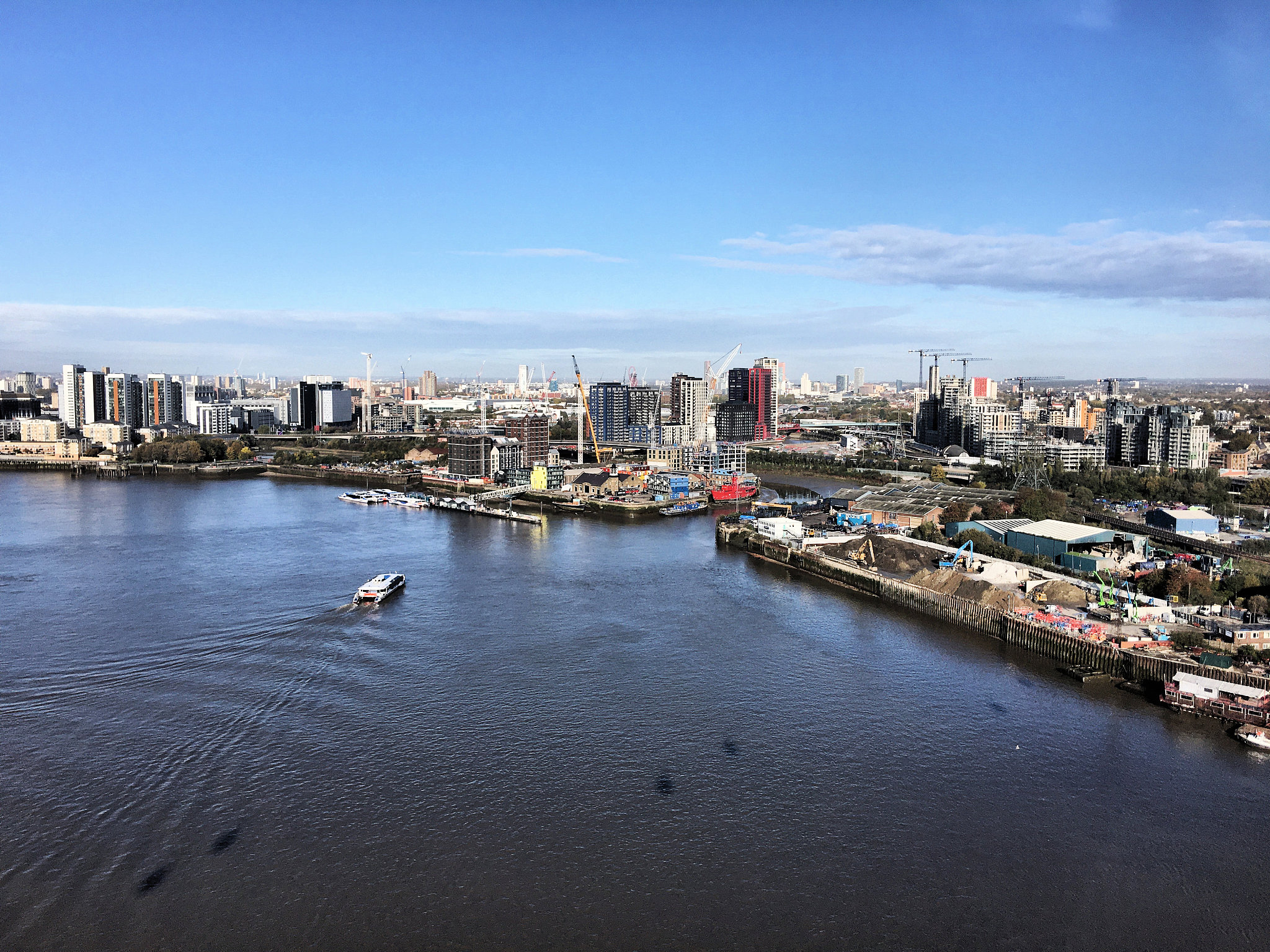 an aerial view of the river thames in london at the isle of dogs