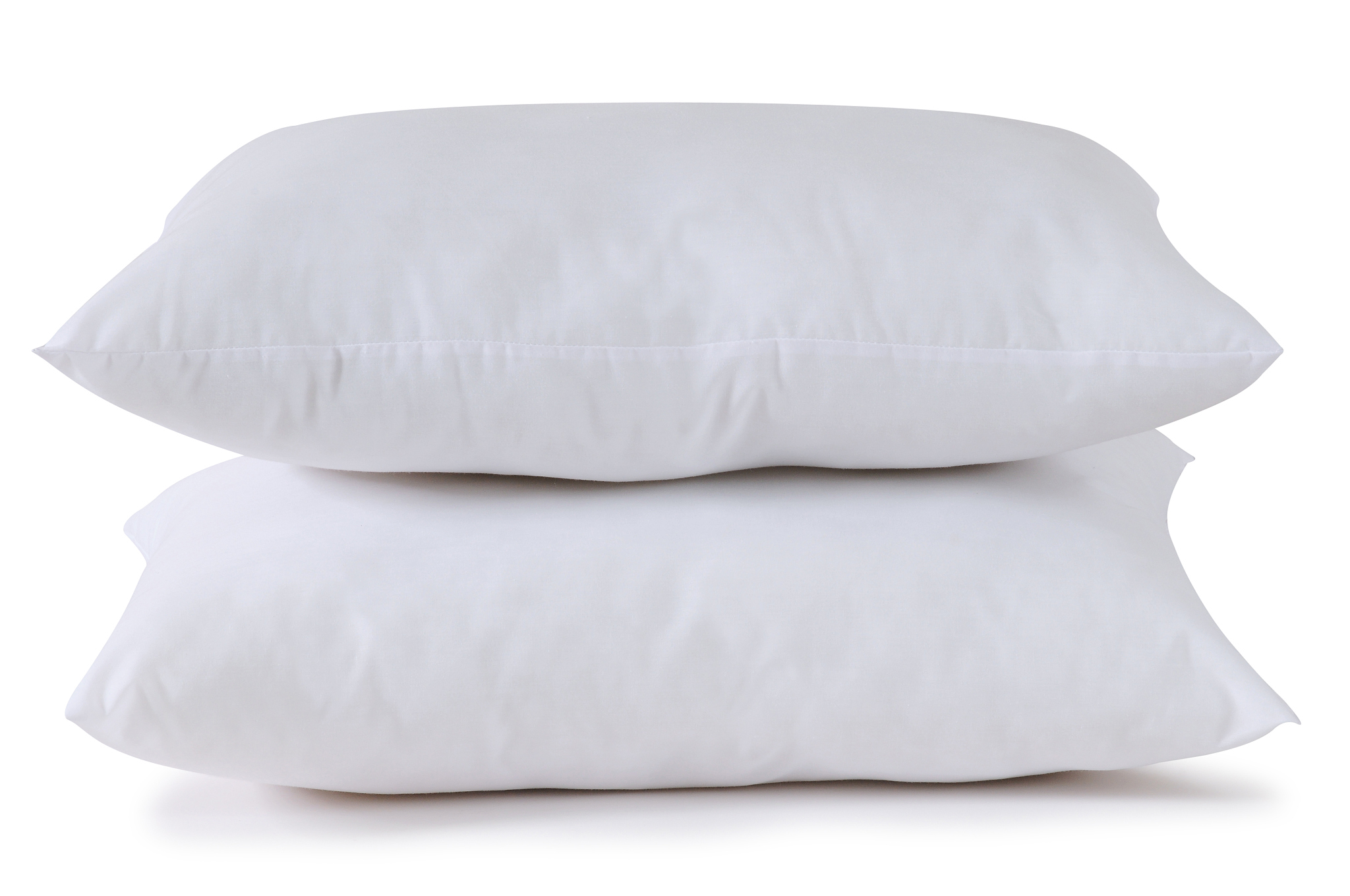 two fluffy white pillows stacked upon each other