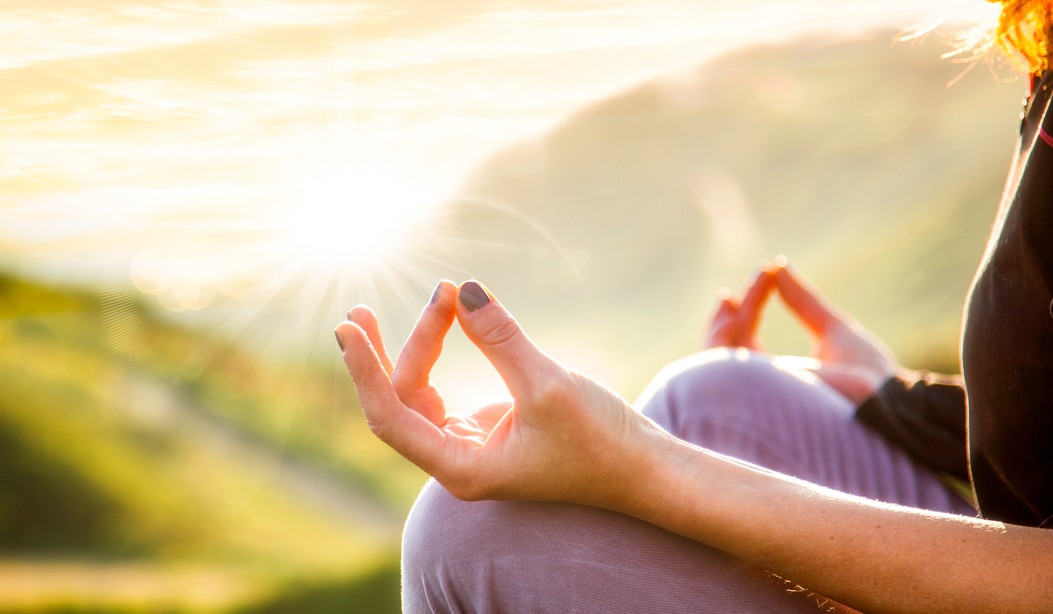 woman doing yoga in beautiful nature background at sunset or sun