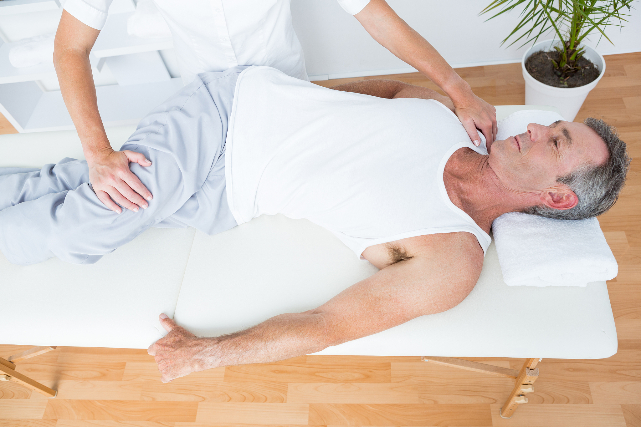 physiotherapist doing leg massag