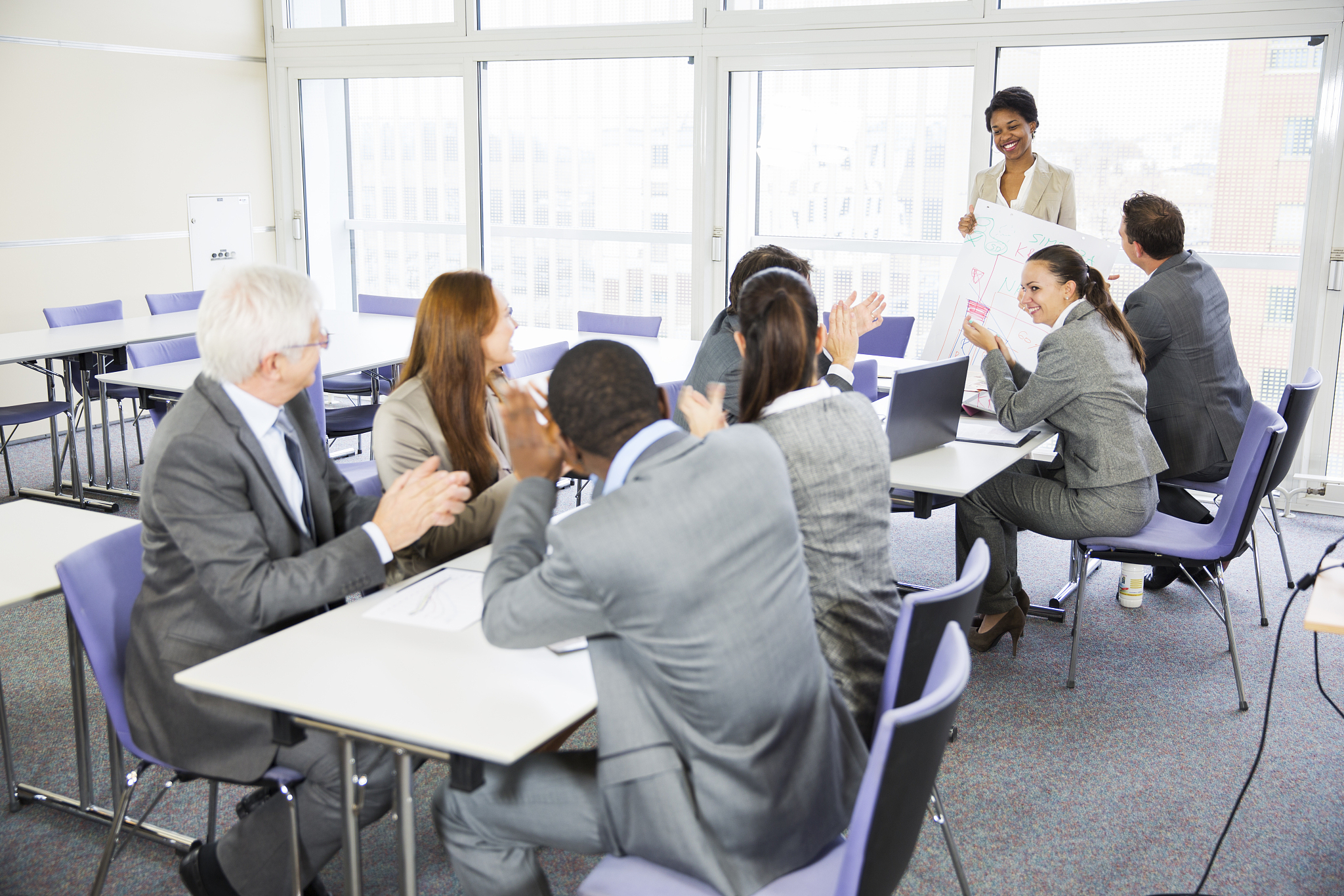 business people in education room listening lecture of  black te