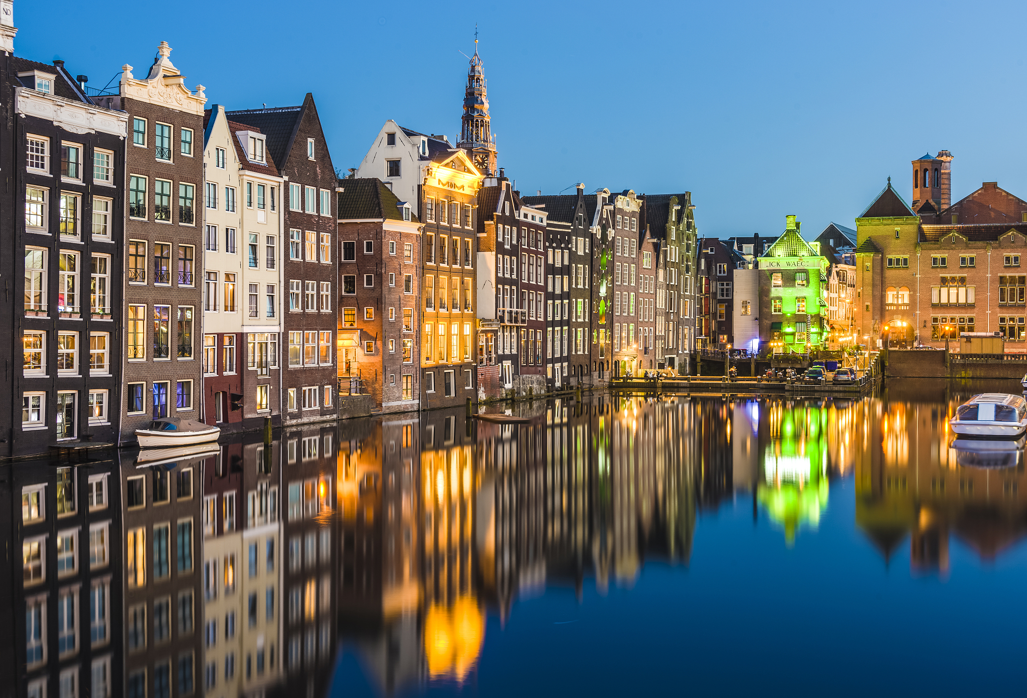 the damrak canal in amsterdam, netherlands.
