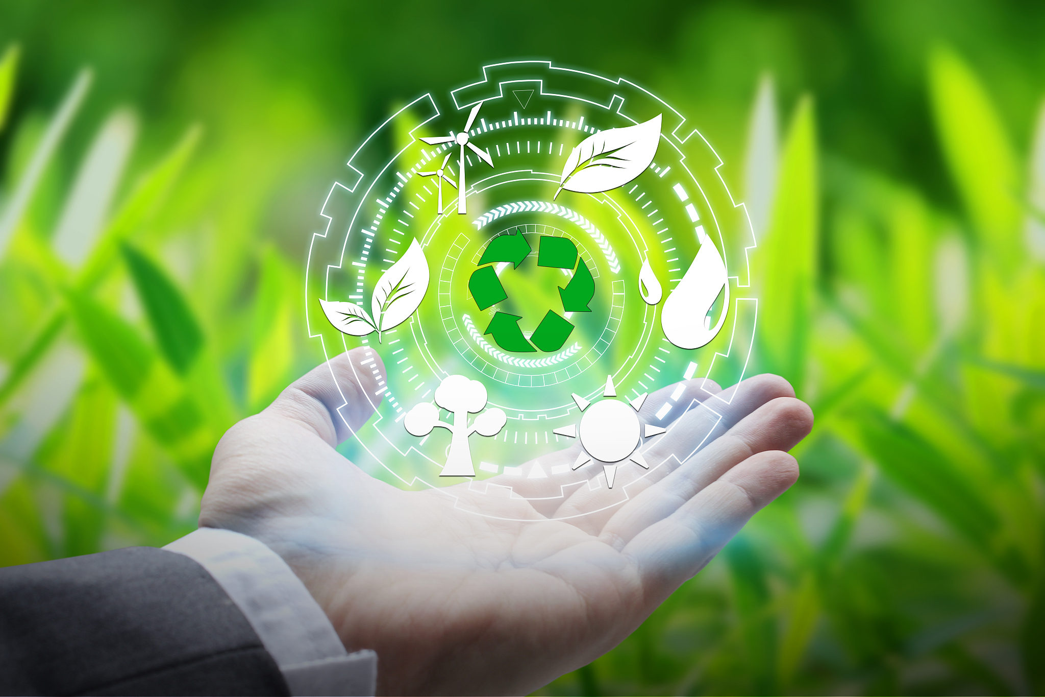hand holding with environment icons
