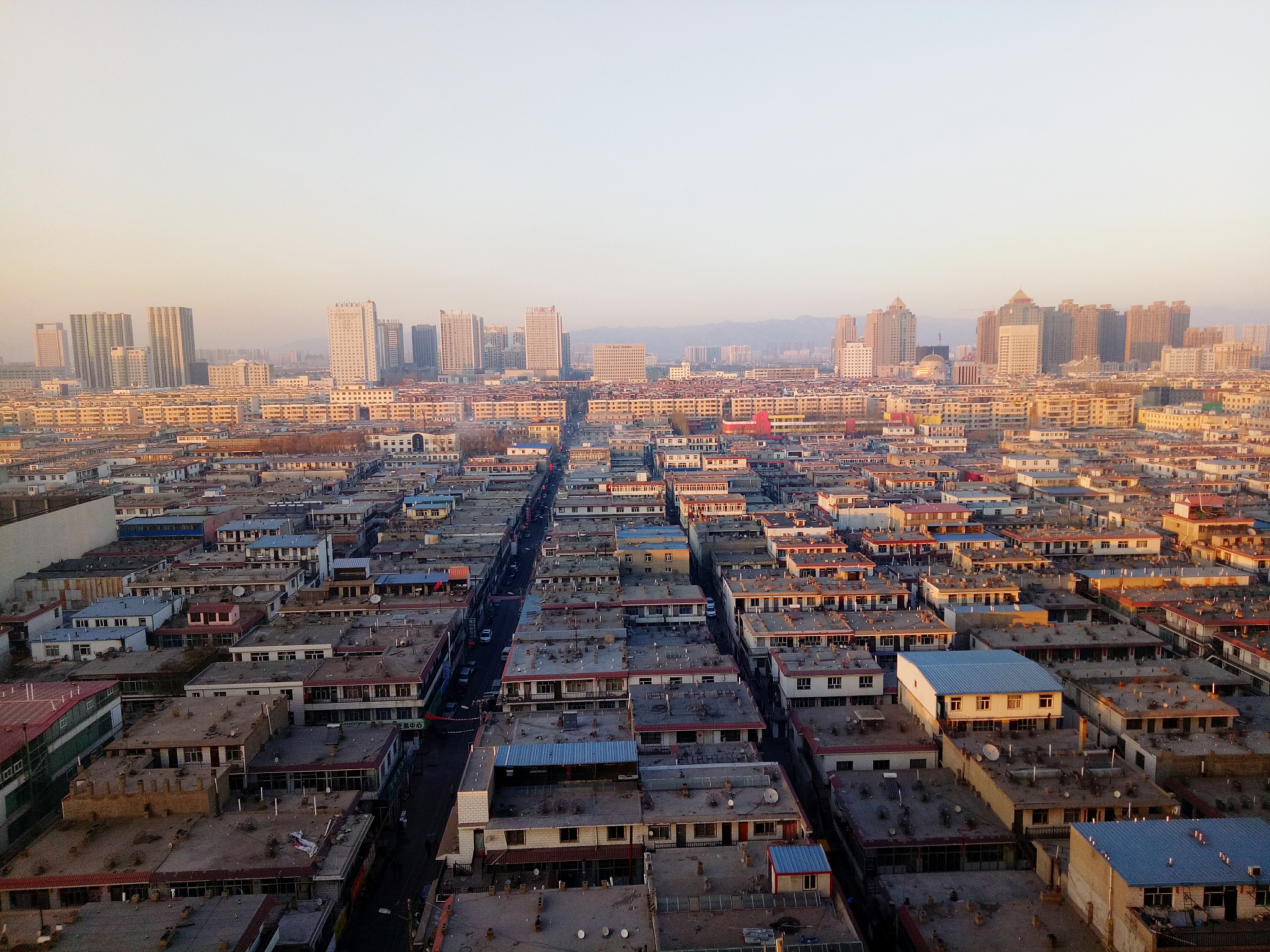 high angle view of buildings in city against clear sky