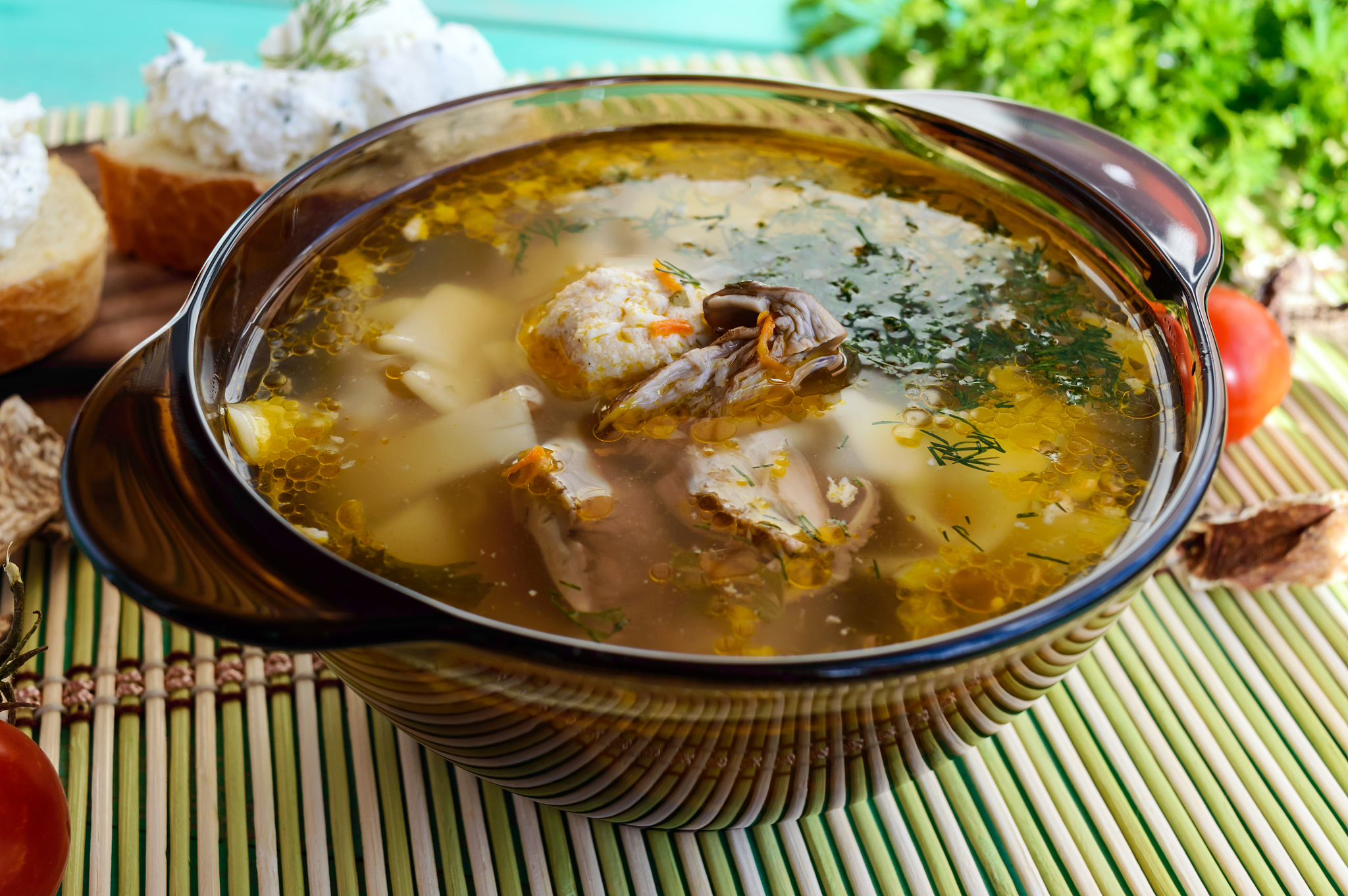 flavored soup of dried porcini mushrooms in a glass tureen.