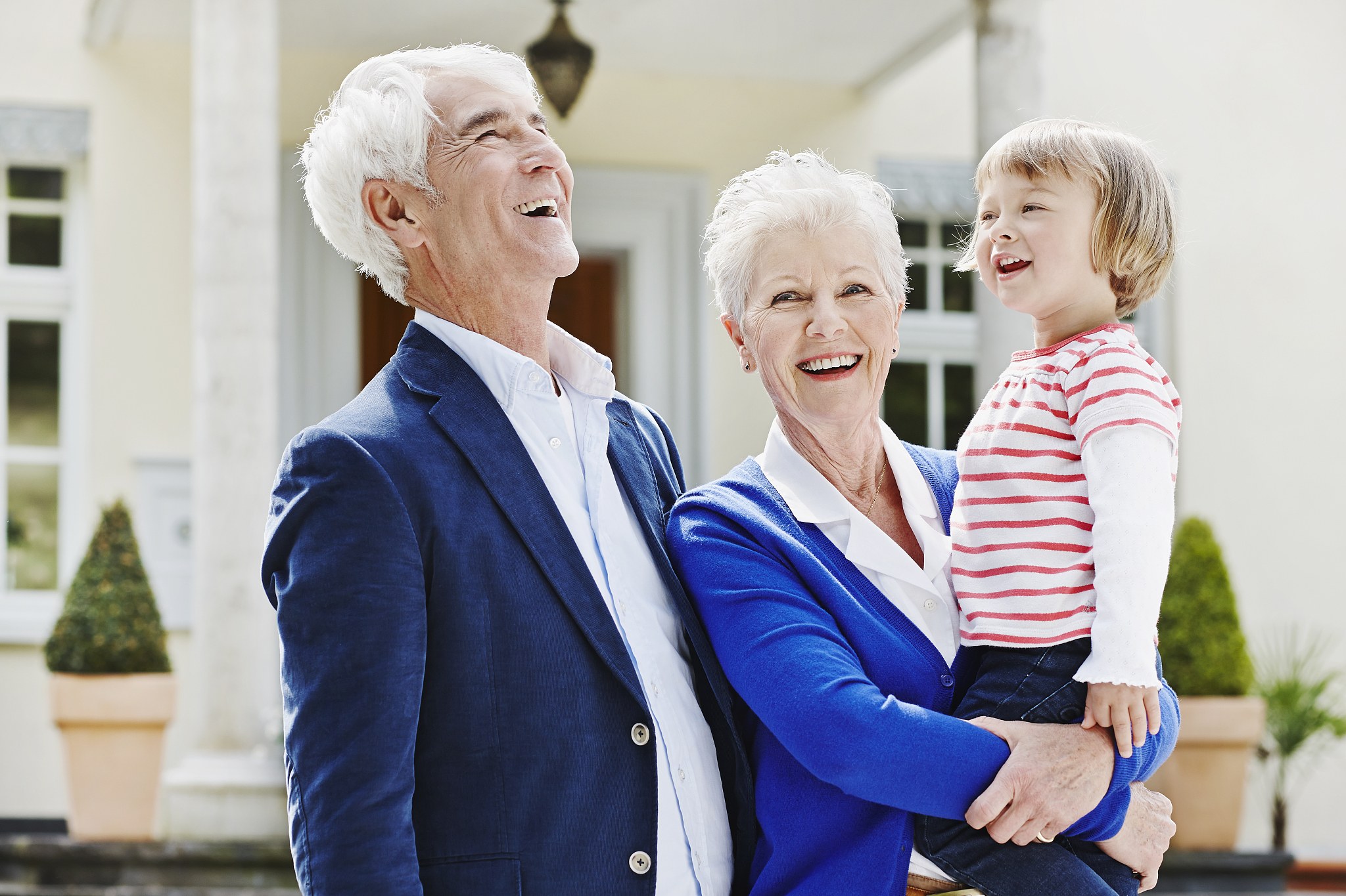germany, hesse, frankfurt, senior couple with granddaughter on a