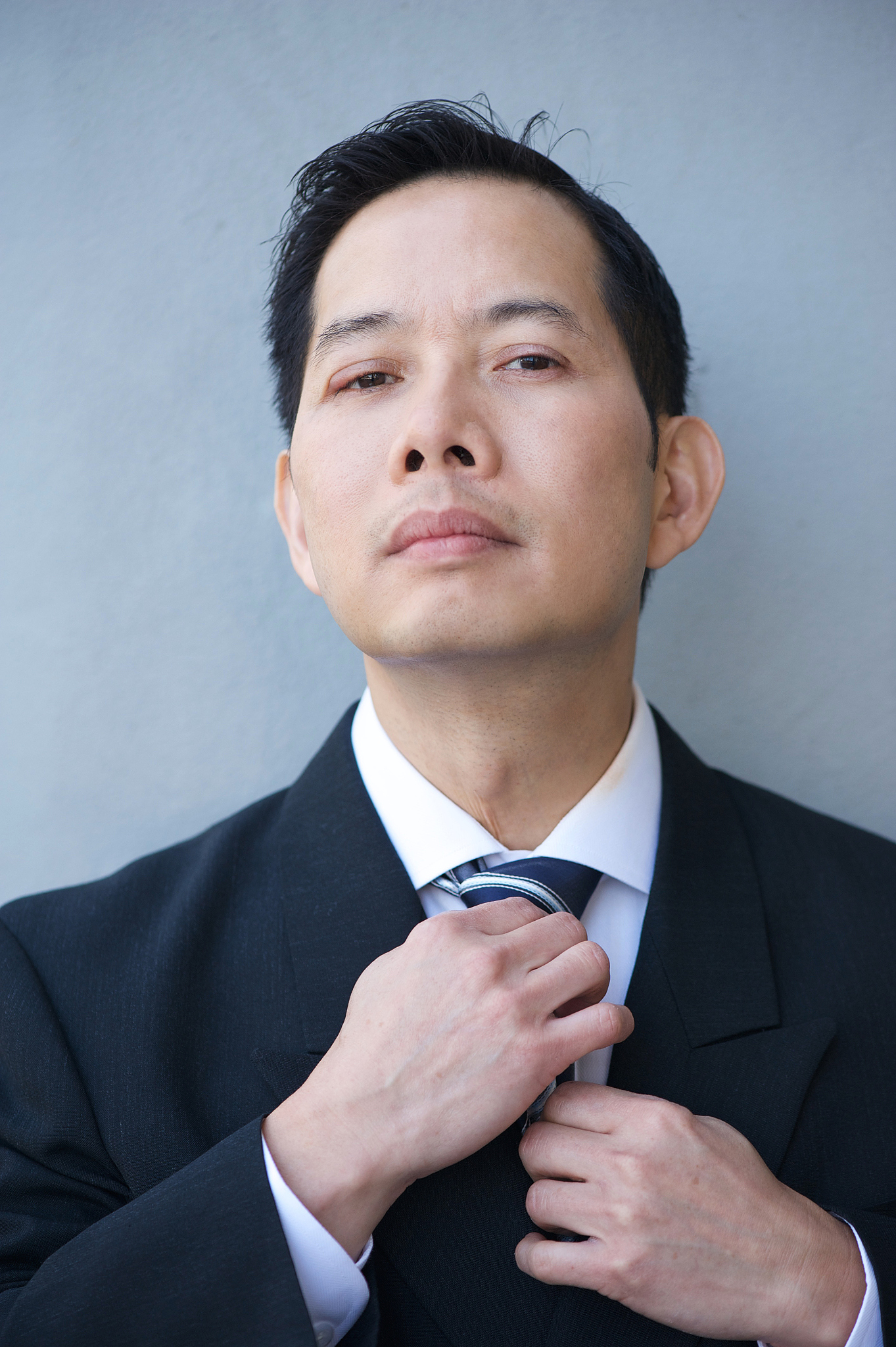 businessman holding necktie