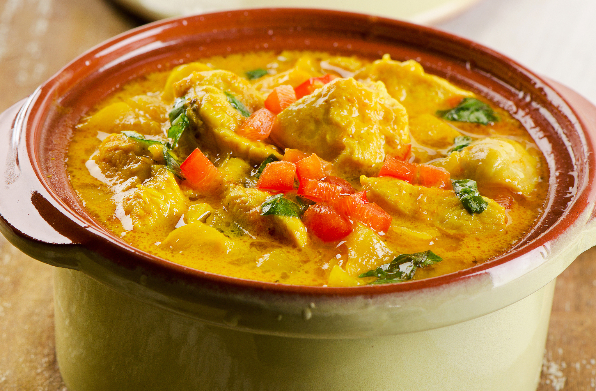 chicken curry on a wooden table