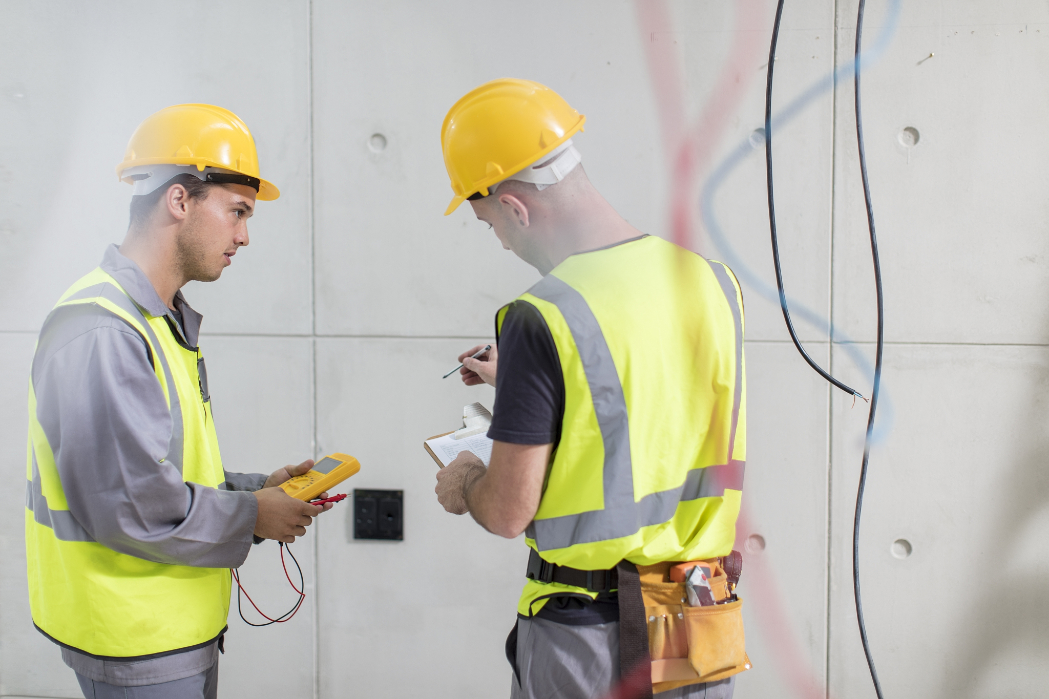 electricians working on construction site