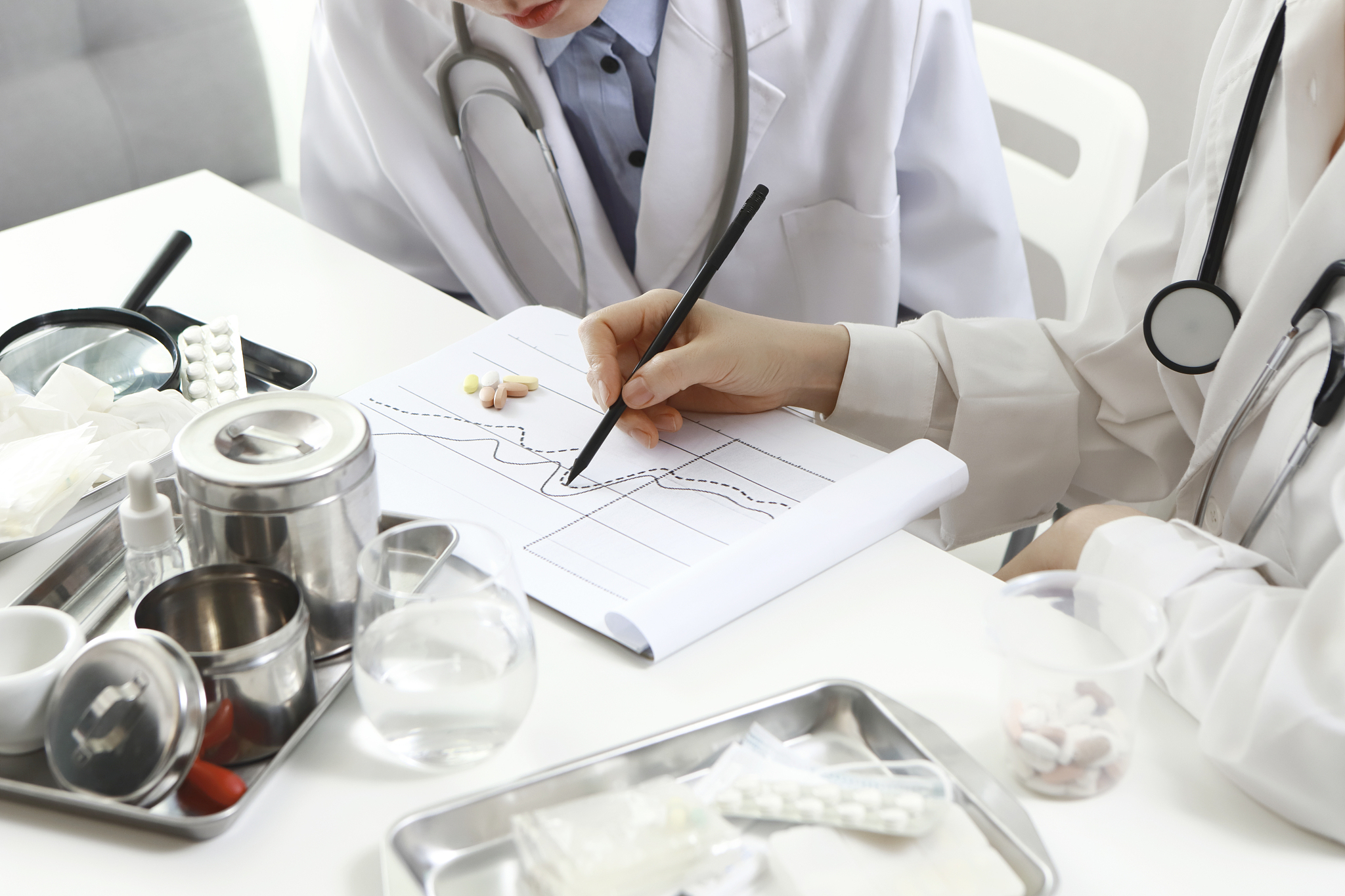 female doctors reviewing medical chart