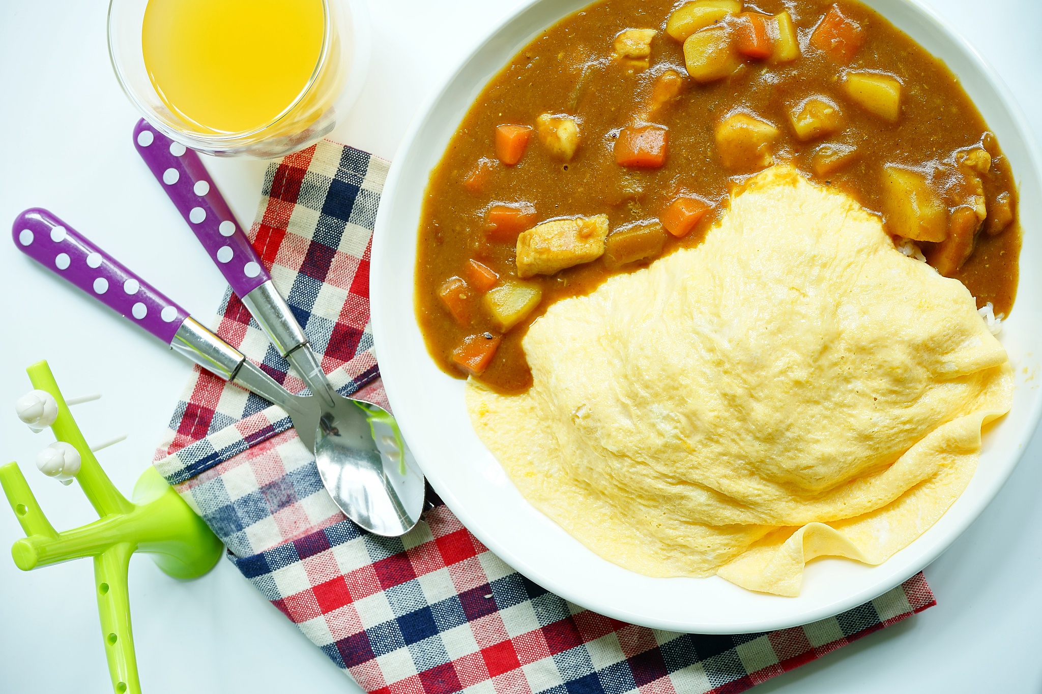 japanese curry omelet rice with chicken and vegetables, top view