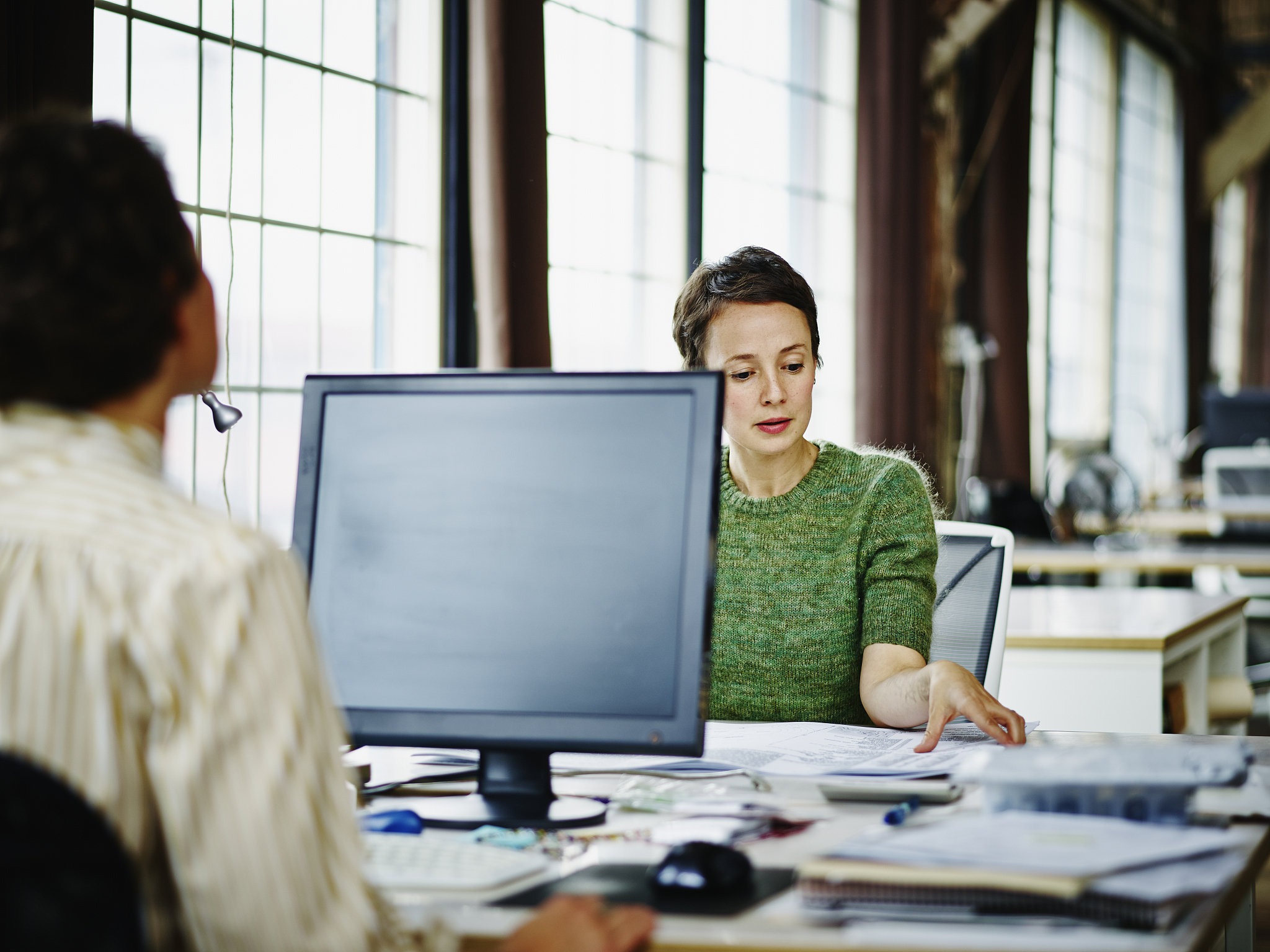 female business owners reviewing project notes