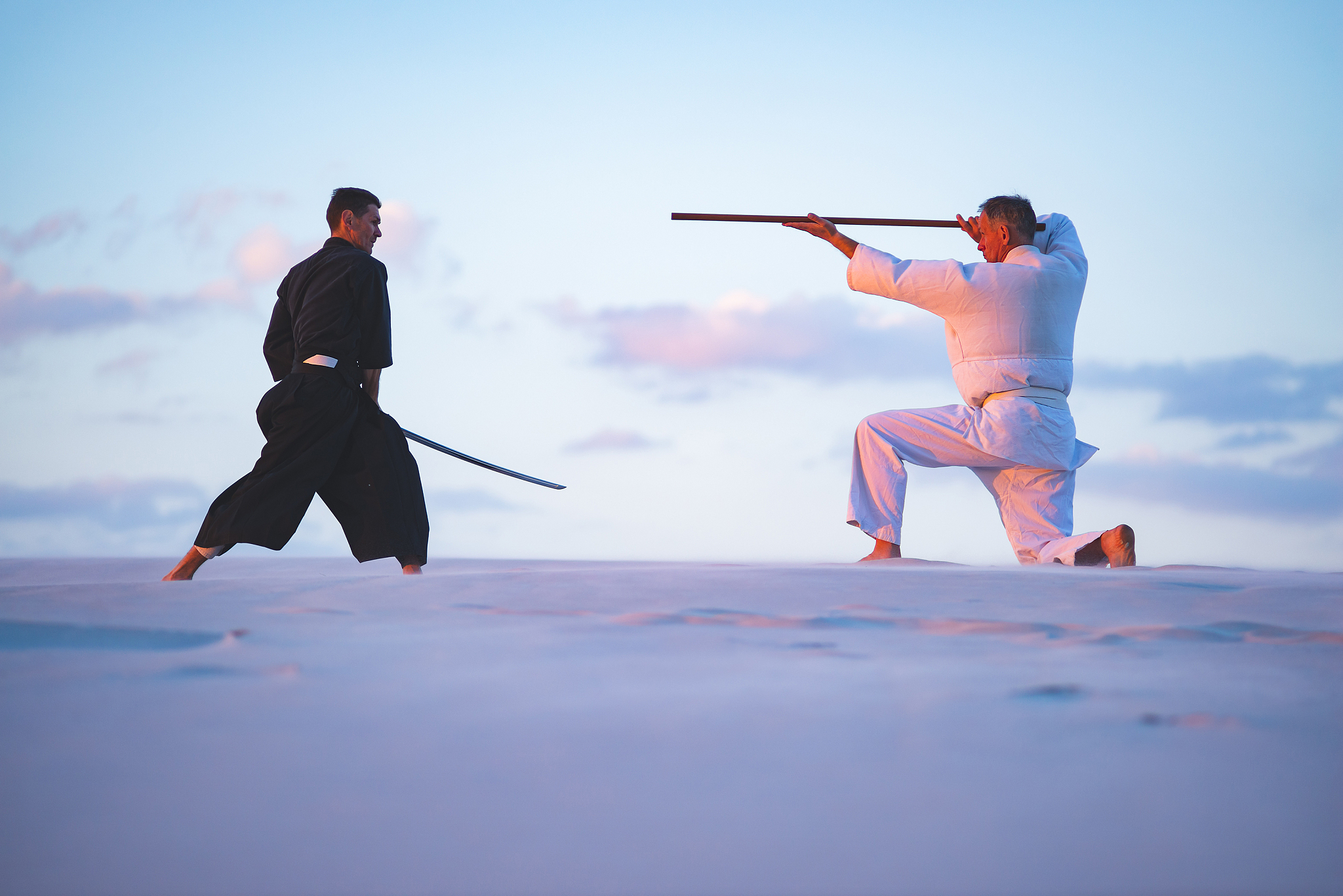concentrated men, in japanese clothes, are practicing martial ar