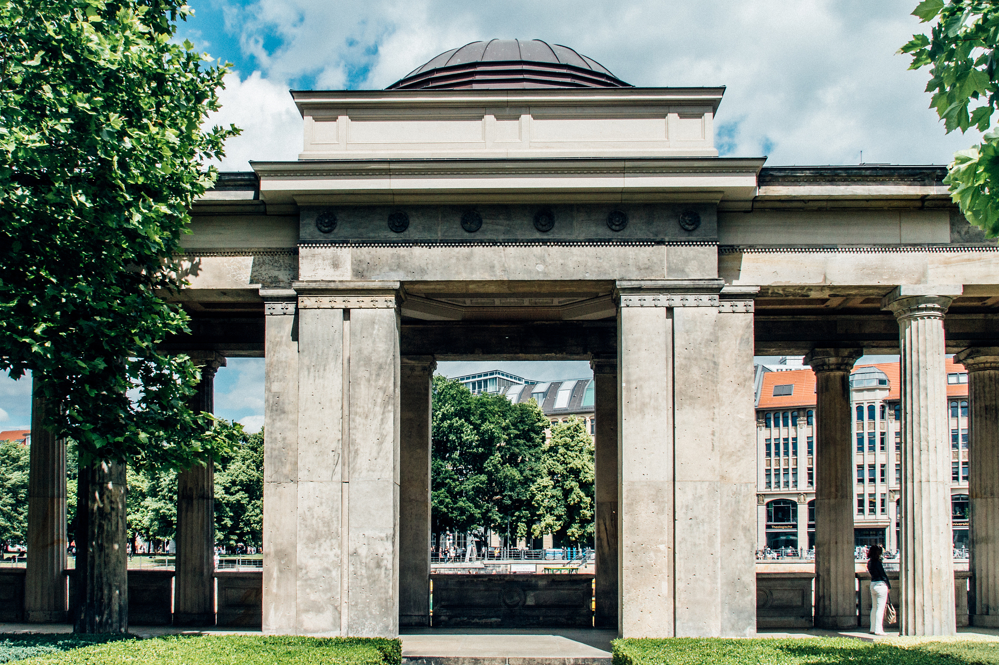 historic entrance gate in city against sky