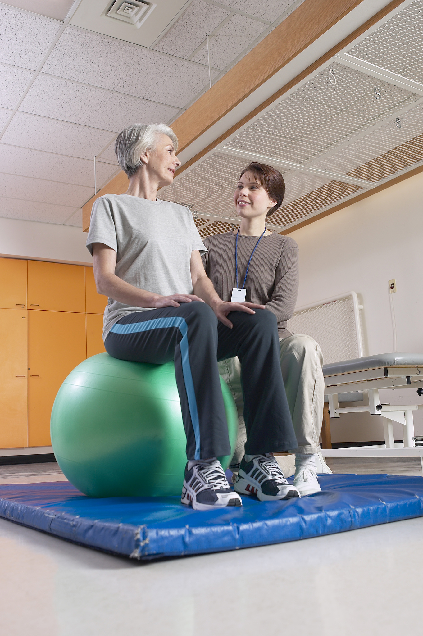 physical therapist helping patient