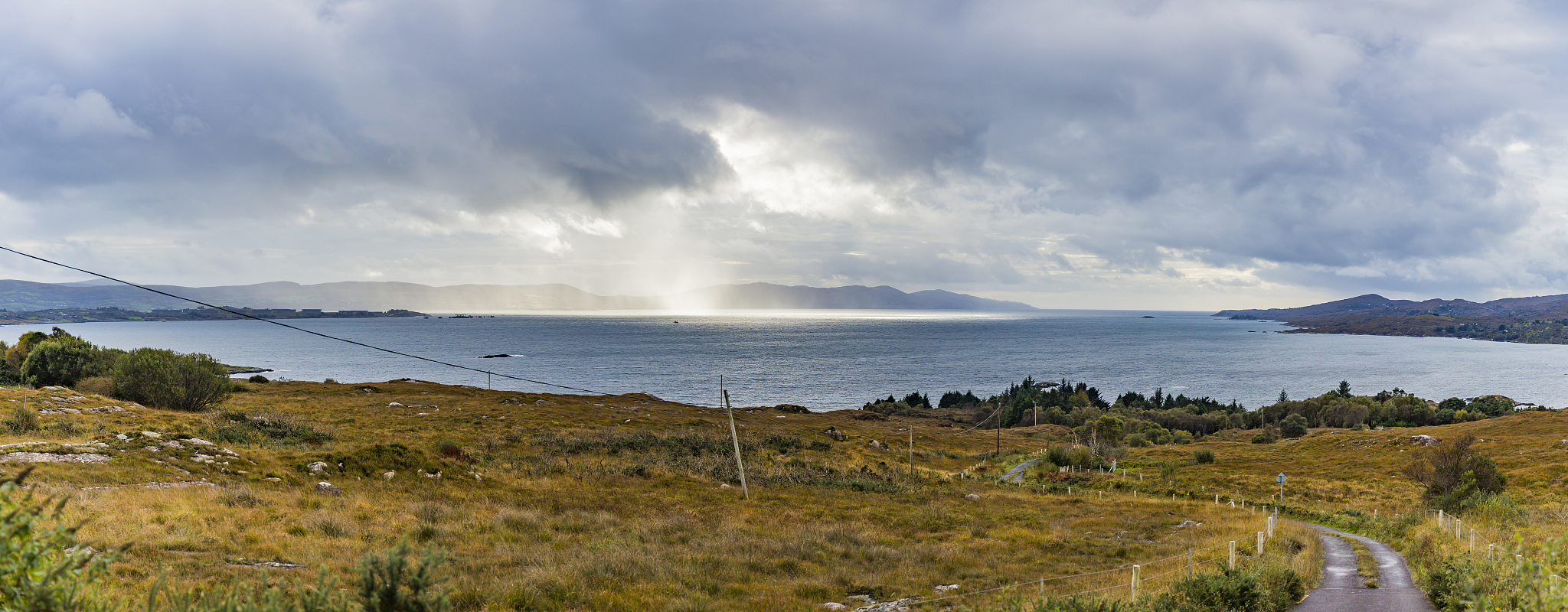 panorama picture of typical irish coast line with green meadows 