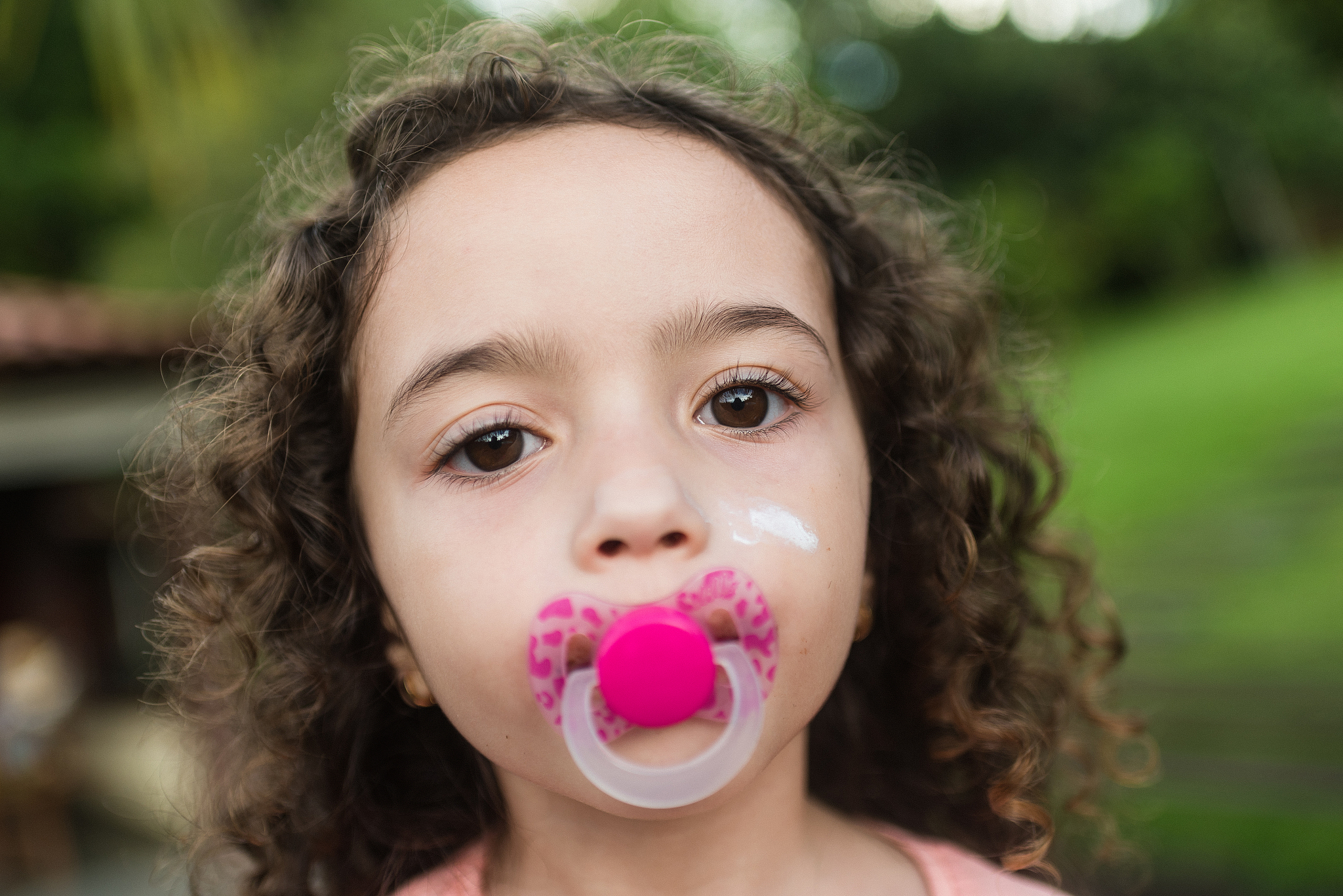 little girl with pacifier