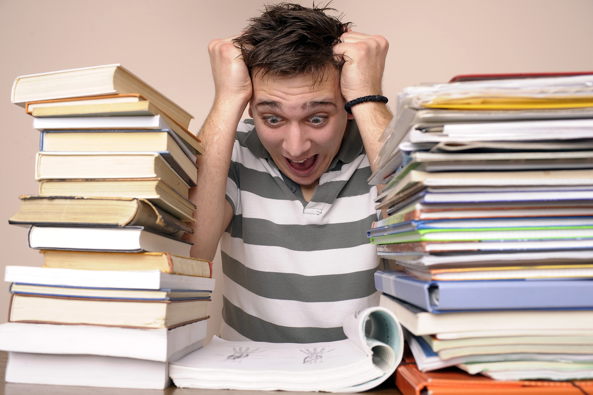 stressed student with books