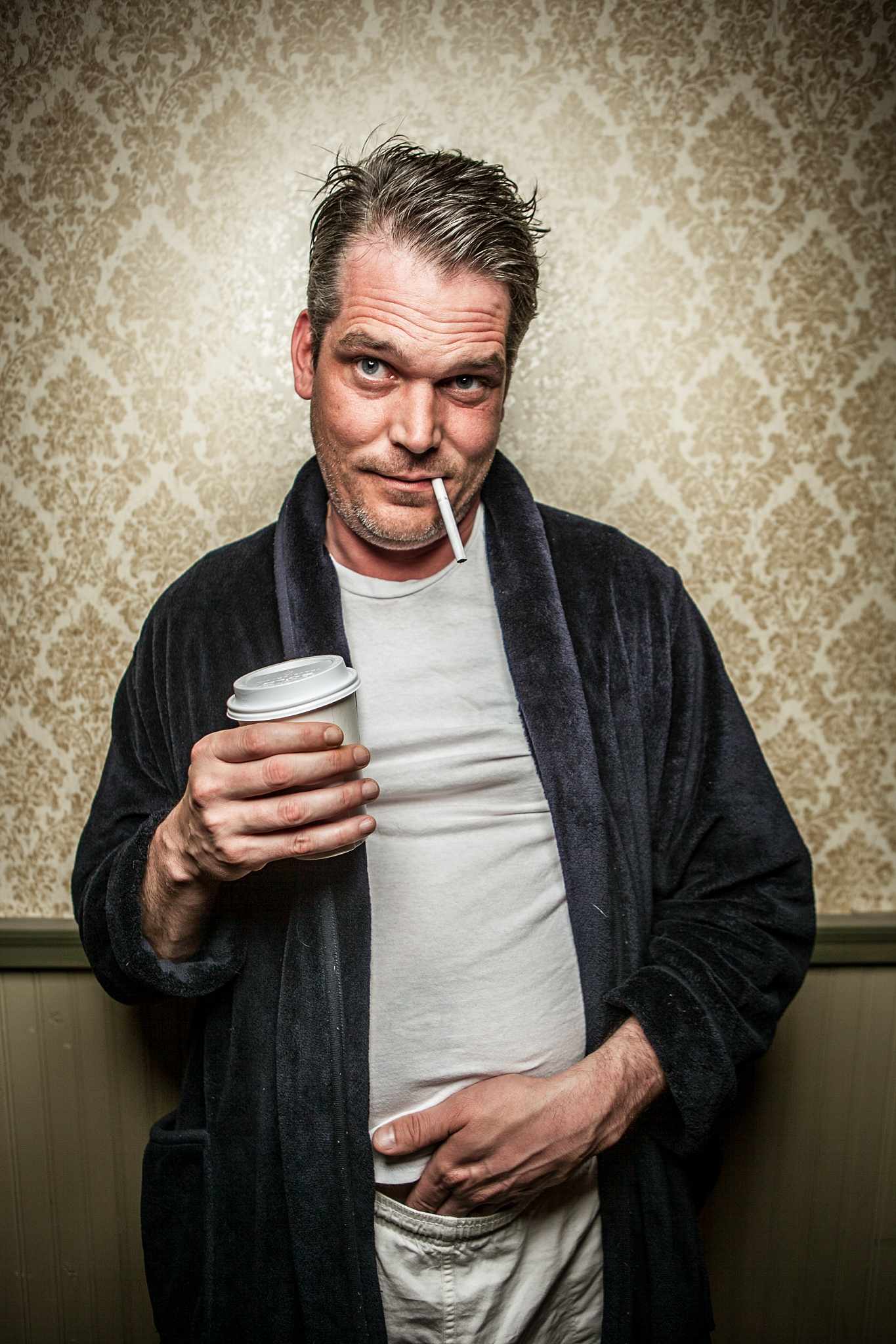 man wearing bathrobe with cigarette, coffee, hand in pants 2