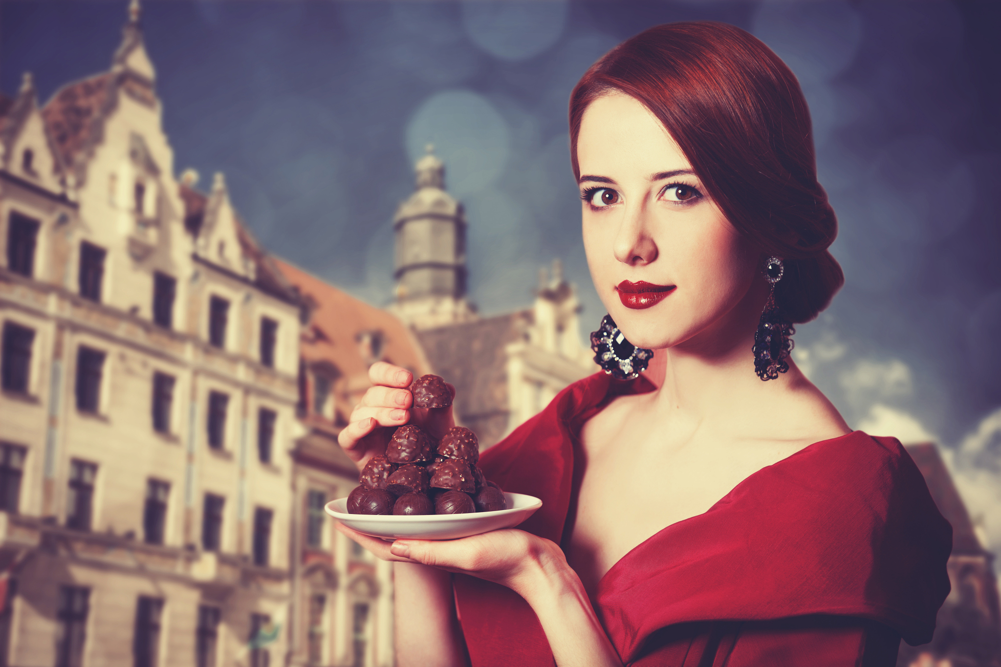 beautiful redhead women with candy.