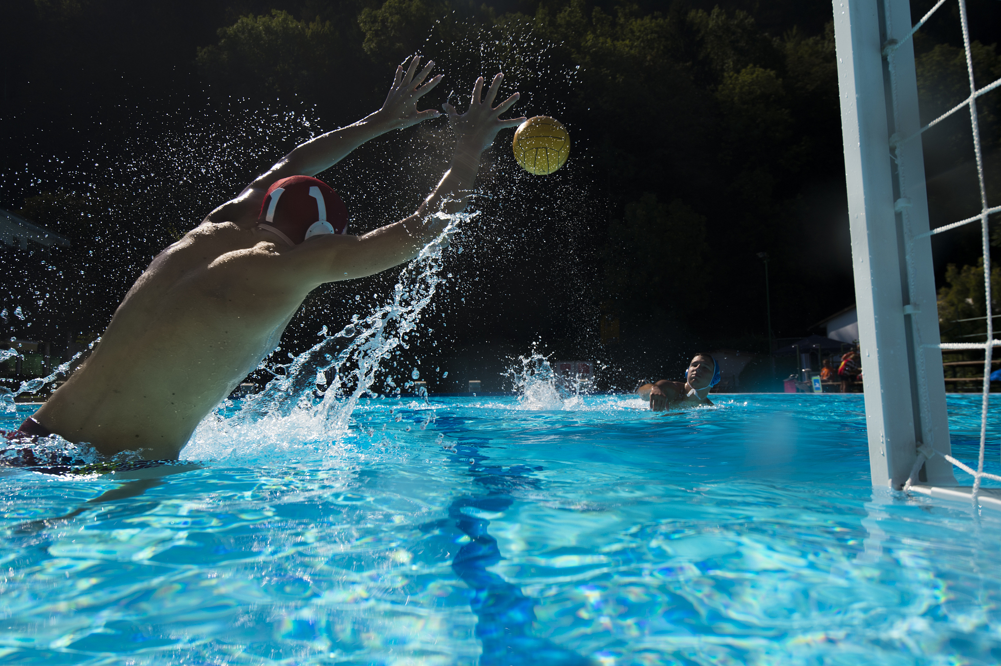 young waterpolo goalie defending