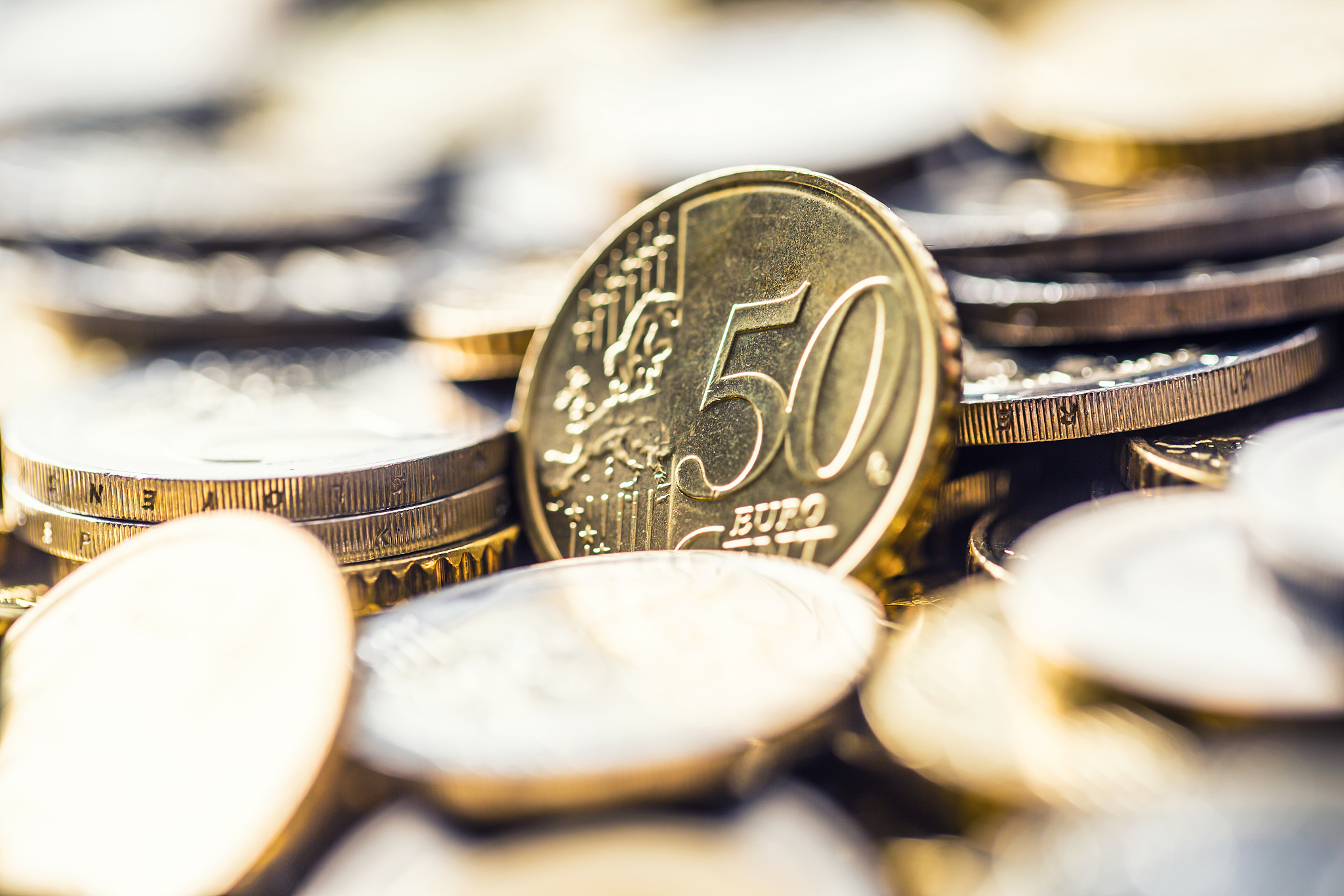 close-up a pile of new euro coins in other compositions.