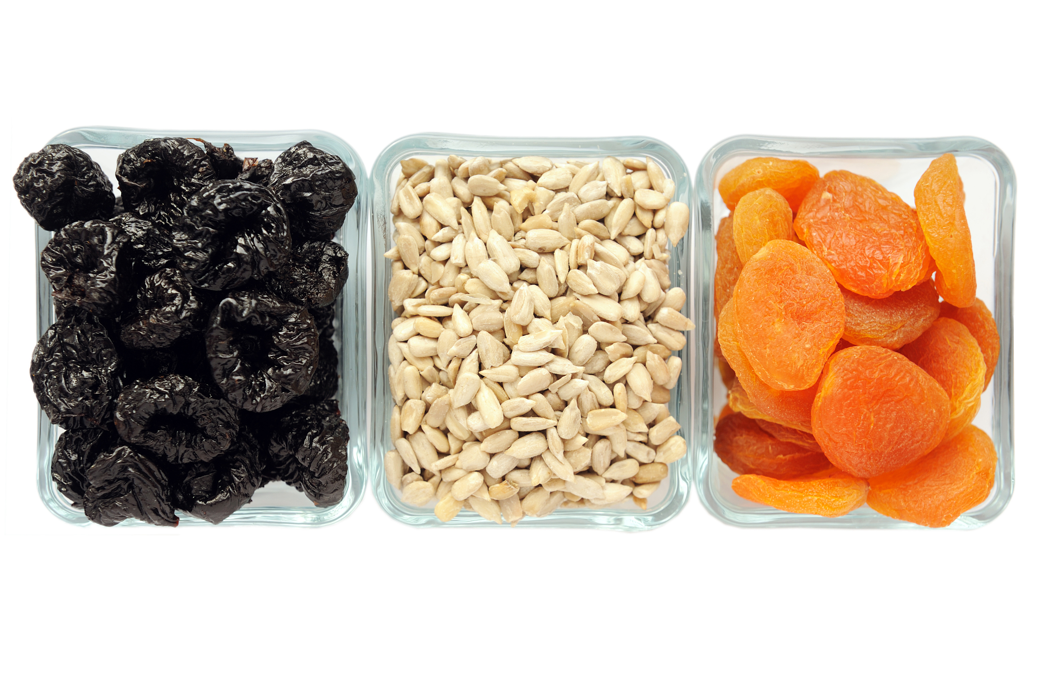 dried fruits in a glassware on a white background