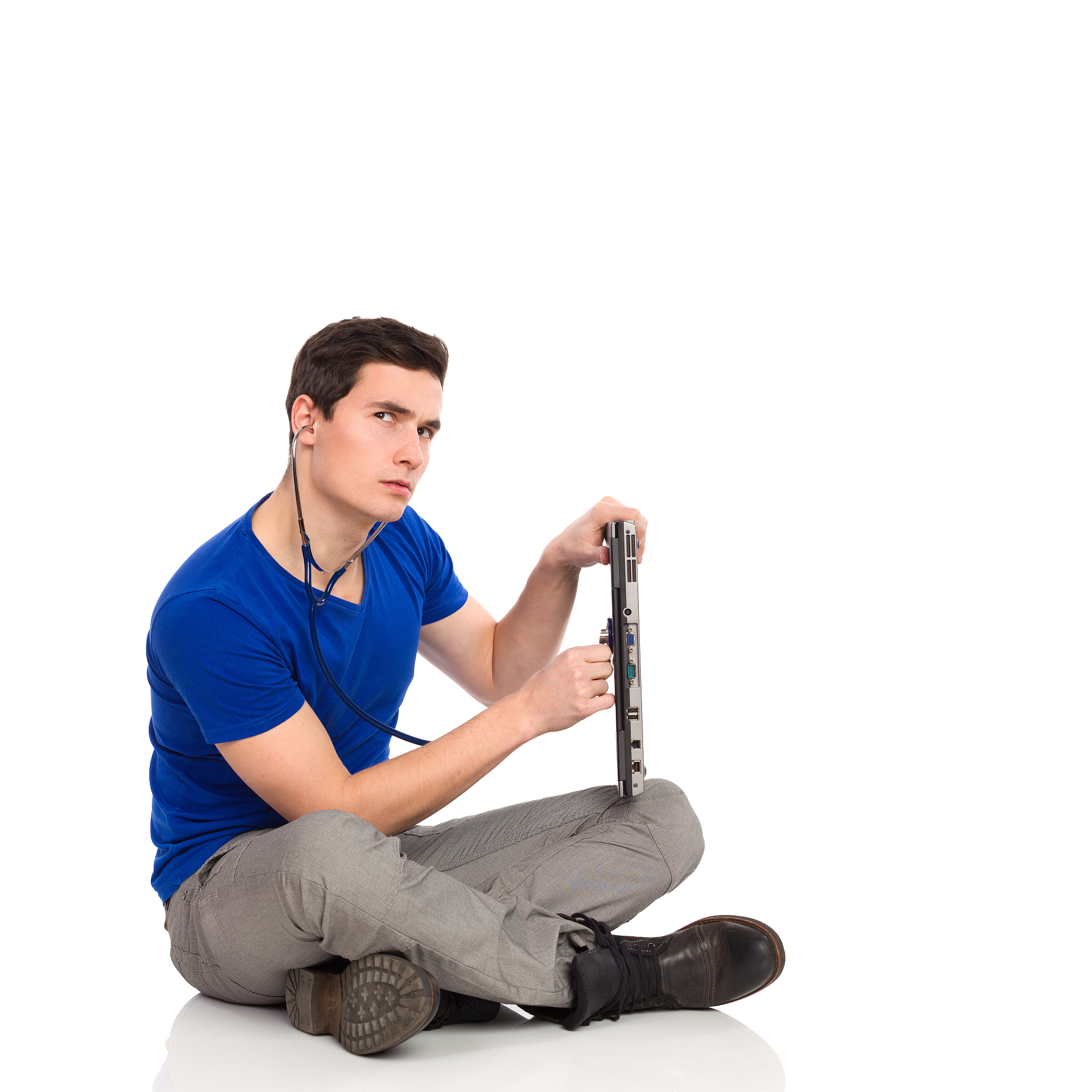 young man with stethoscope examining laptop.