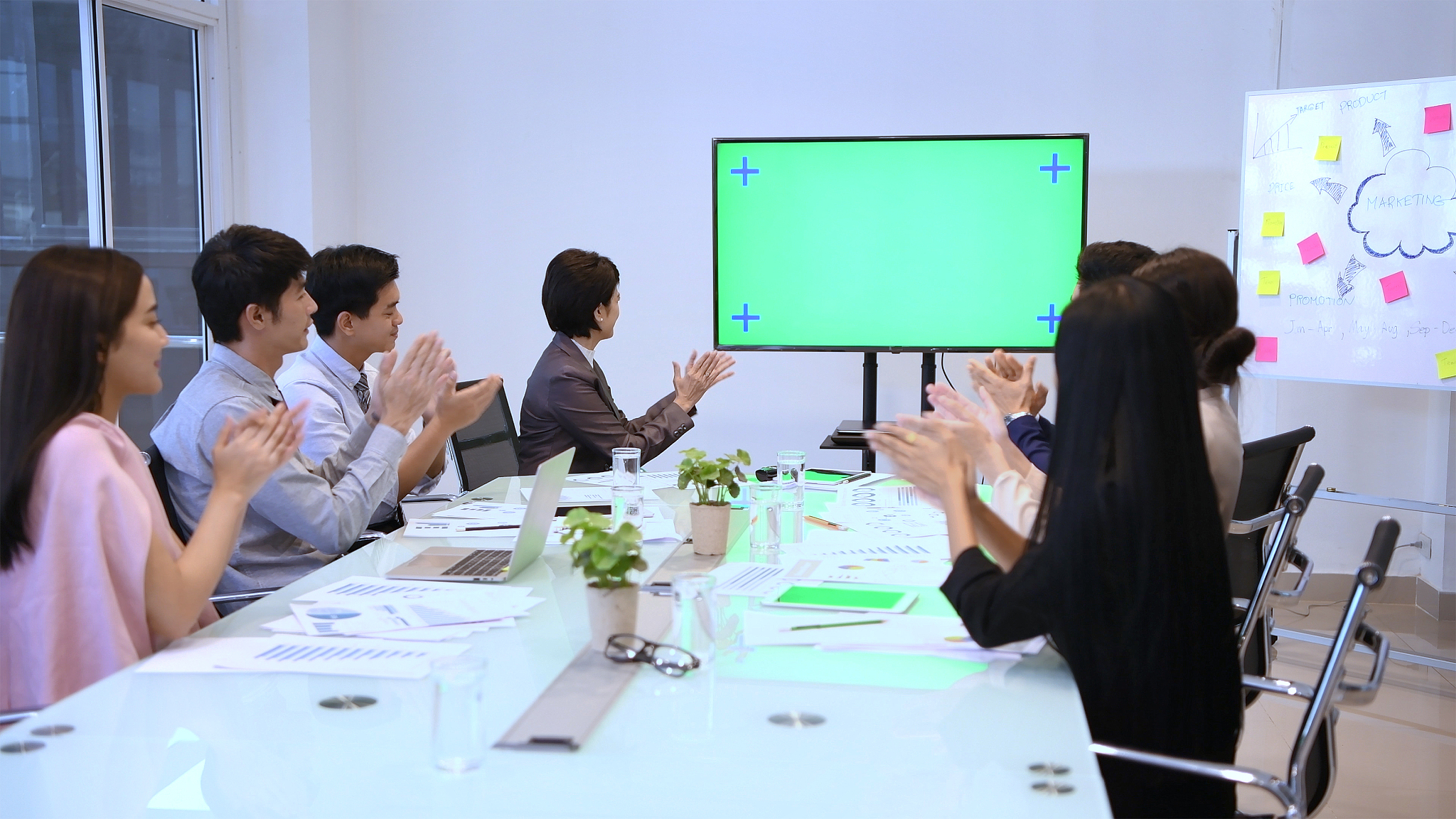 business people applauding in conference room