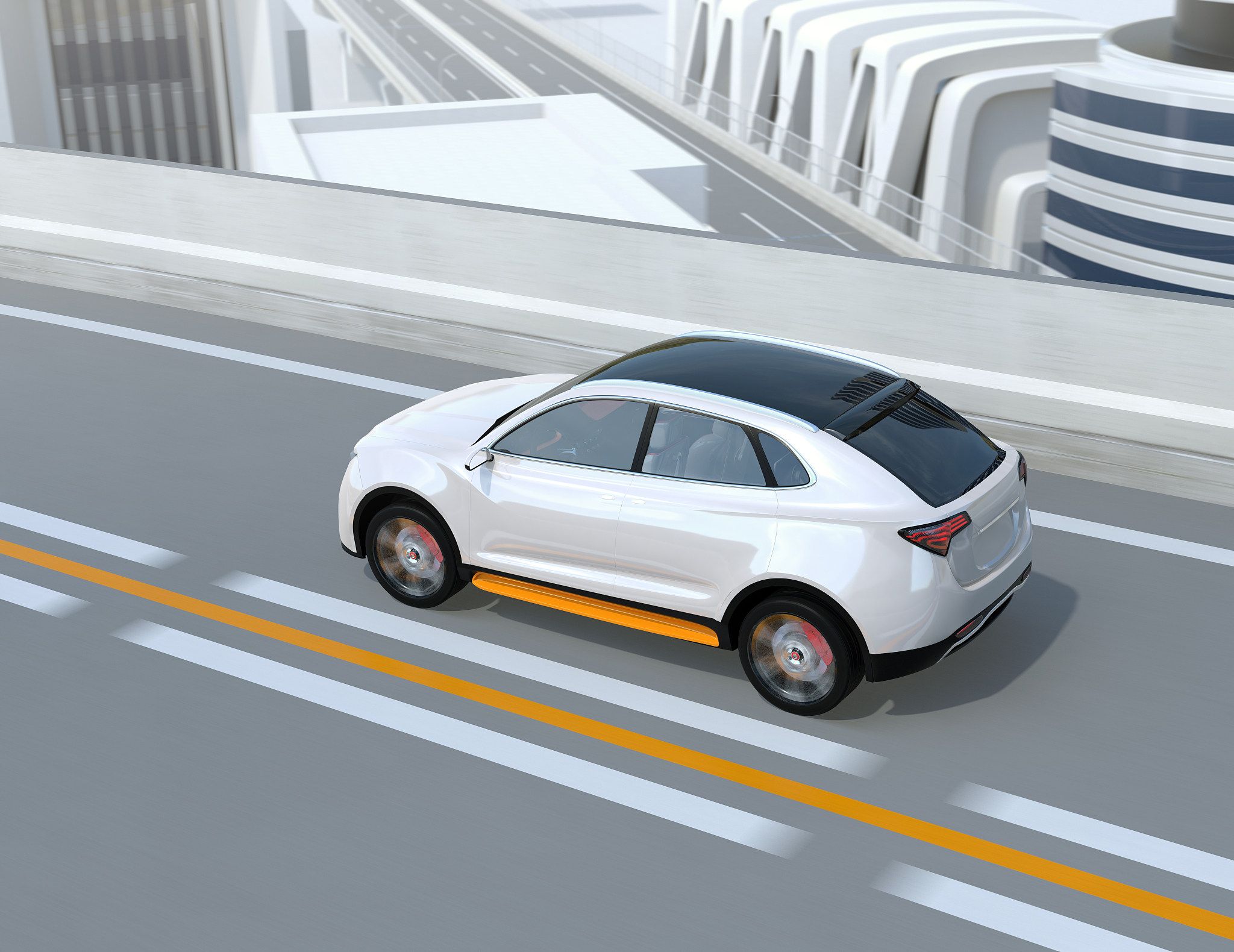 rear view of white electric suv driving on the highway