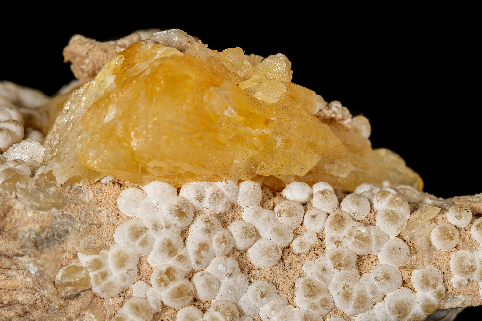 macro stone aragonite mineral on a black background