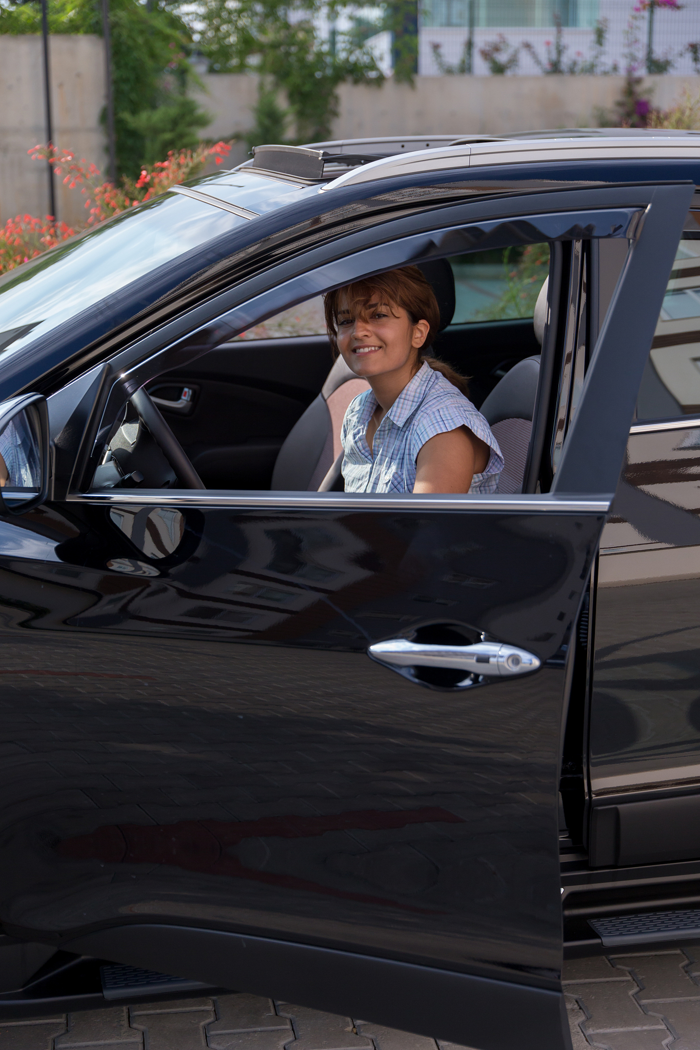 girl is entering the car