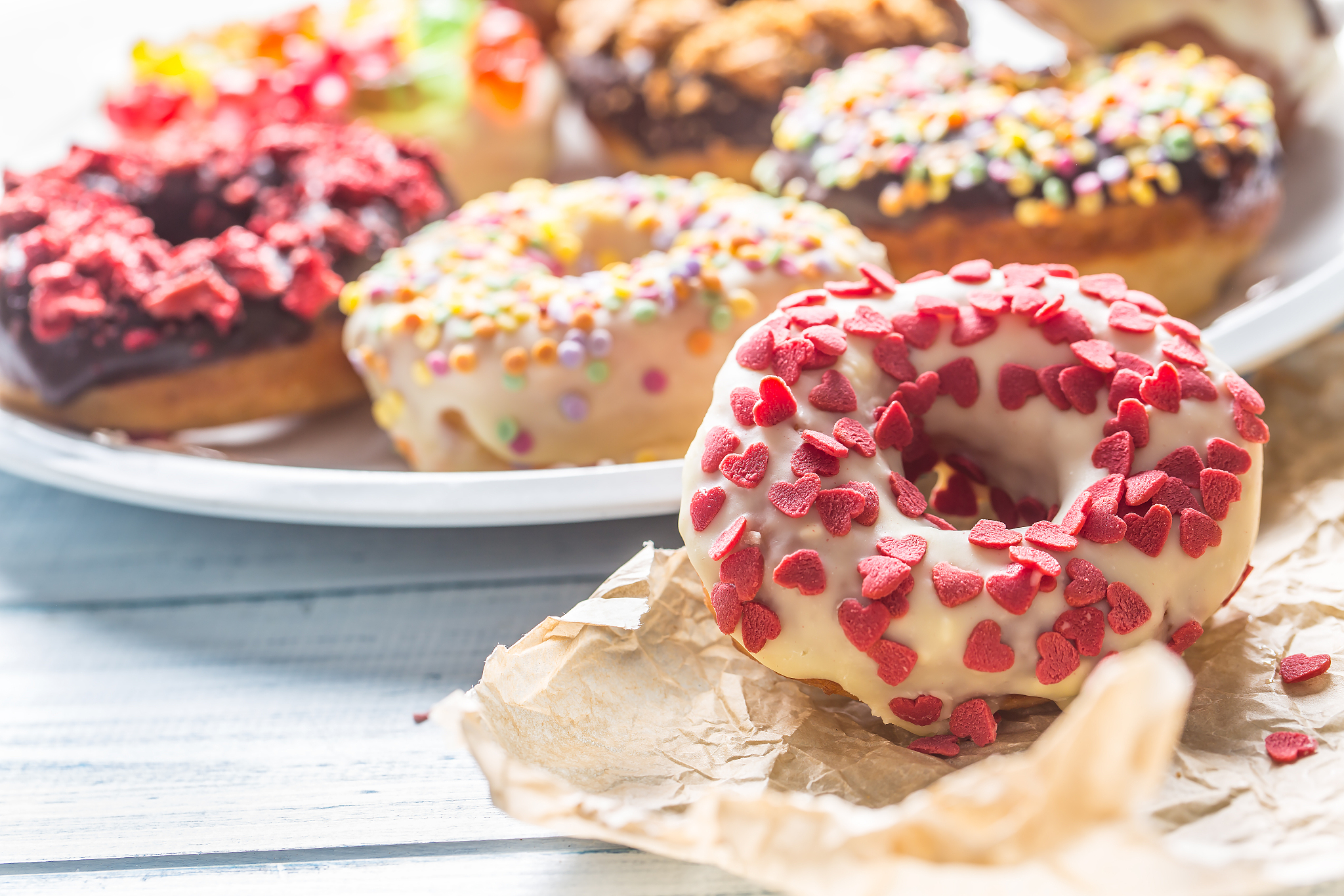 sweet glazed donuts on table - close up