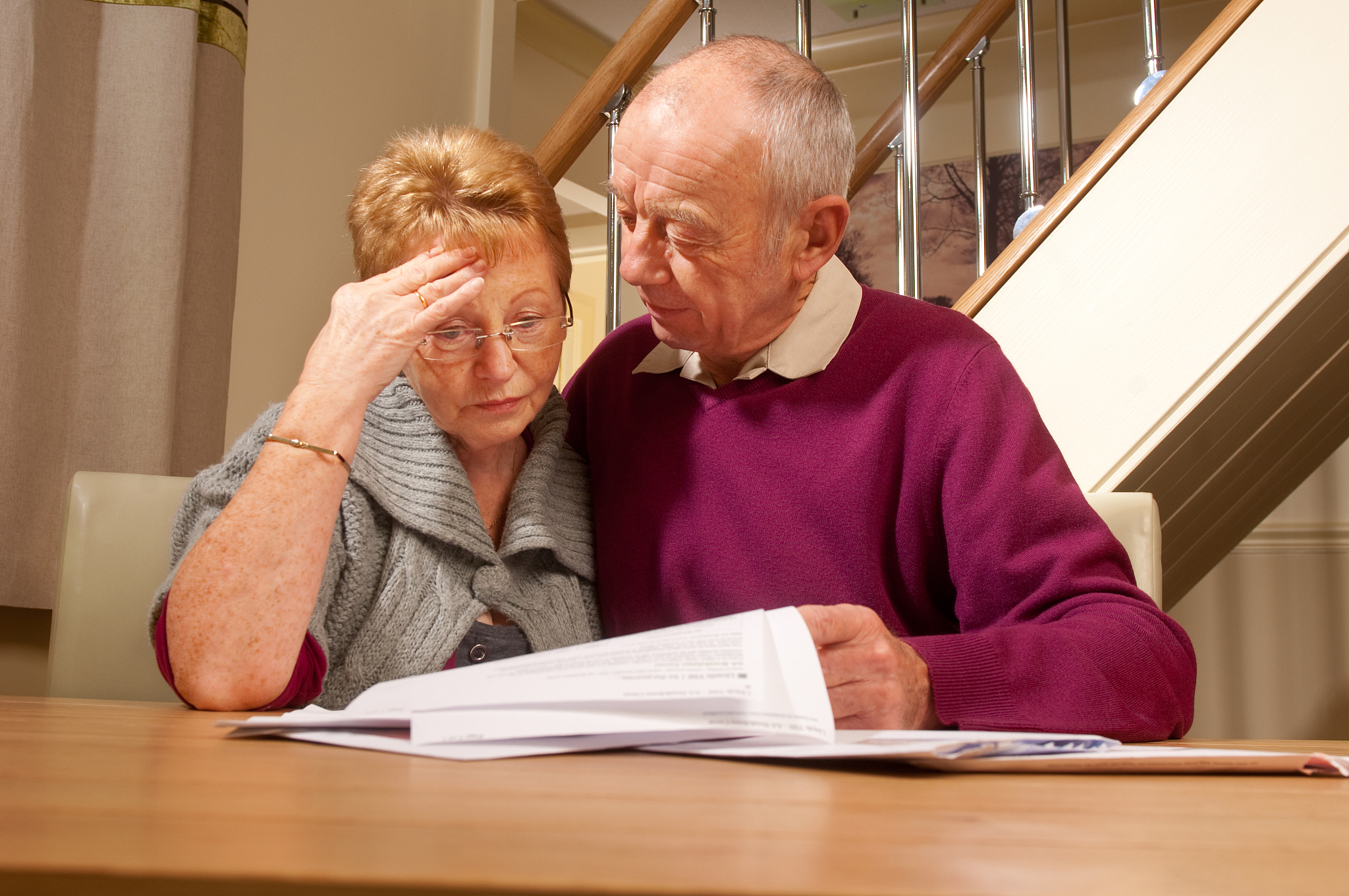 senior couple worry about bills