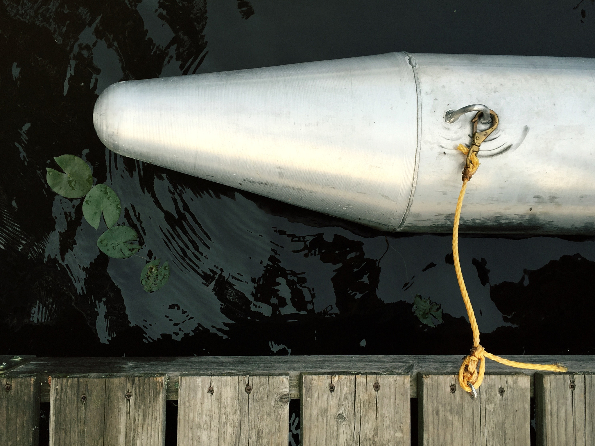 high angle view of metallic boat on lake