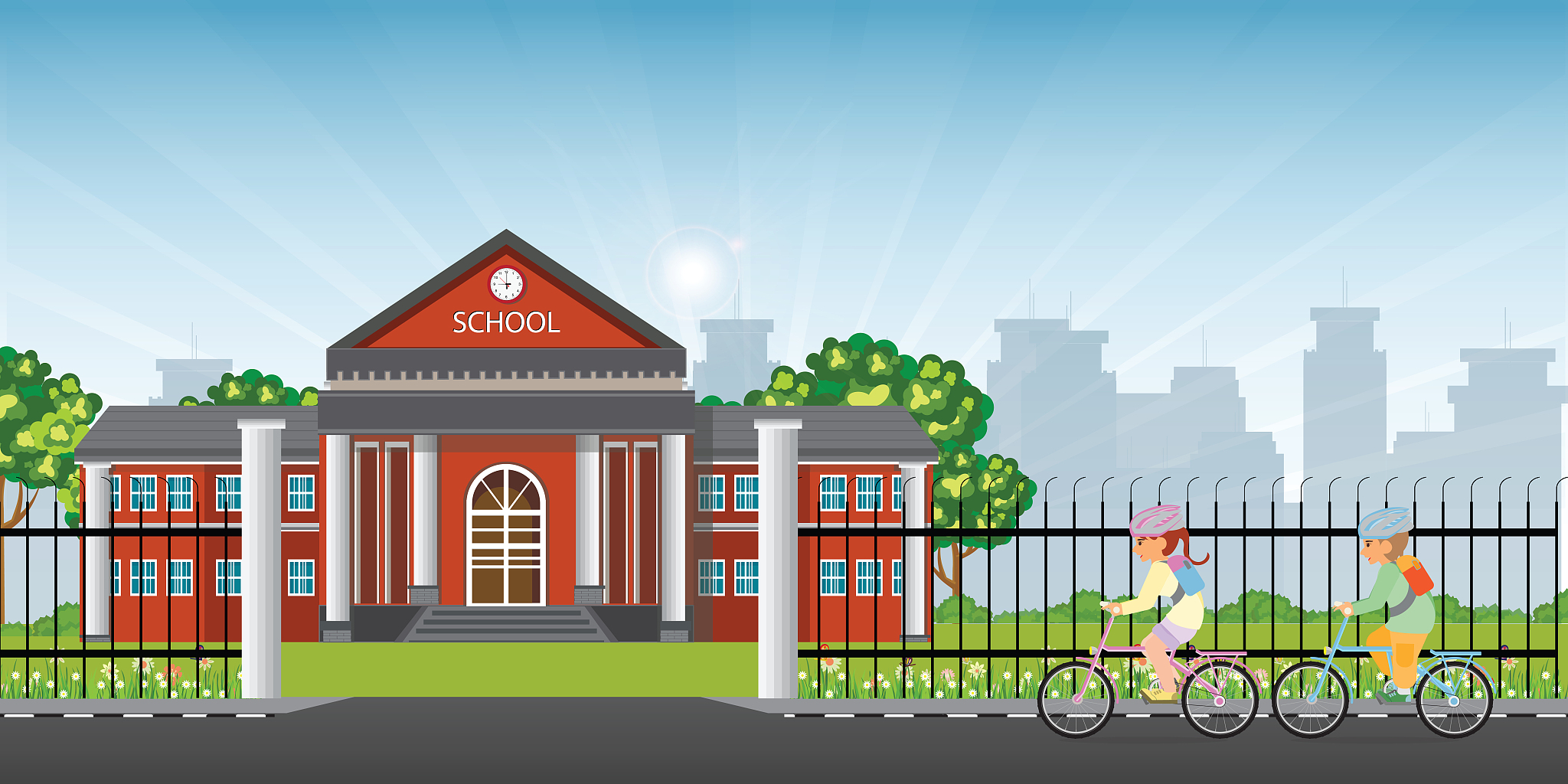 little kids riding a bicycle in front of school.