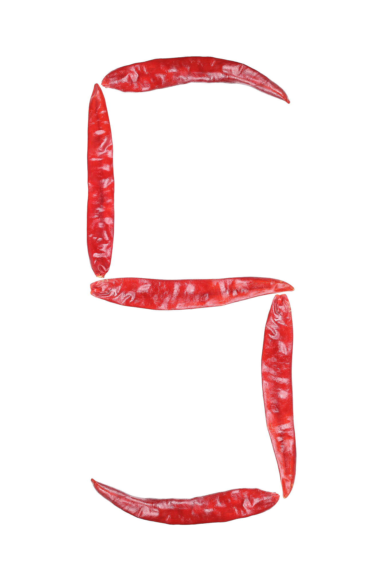 capital letter s by dry chili isolated on white