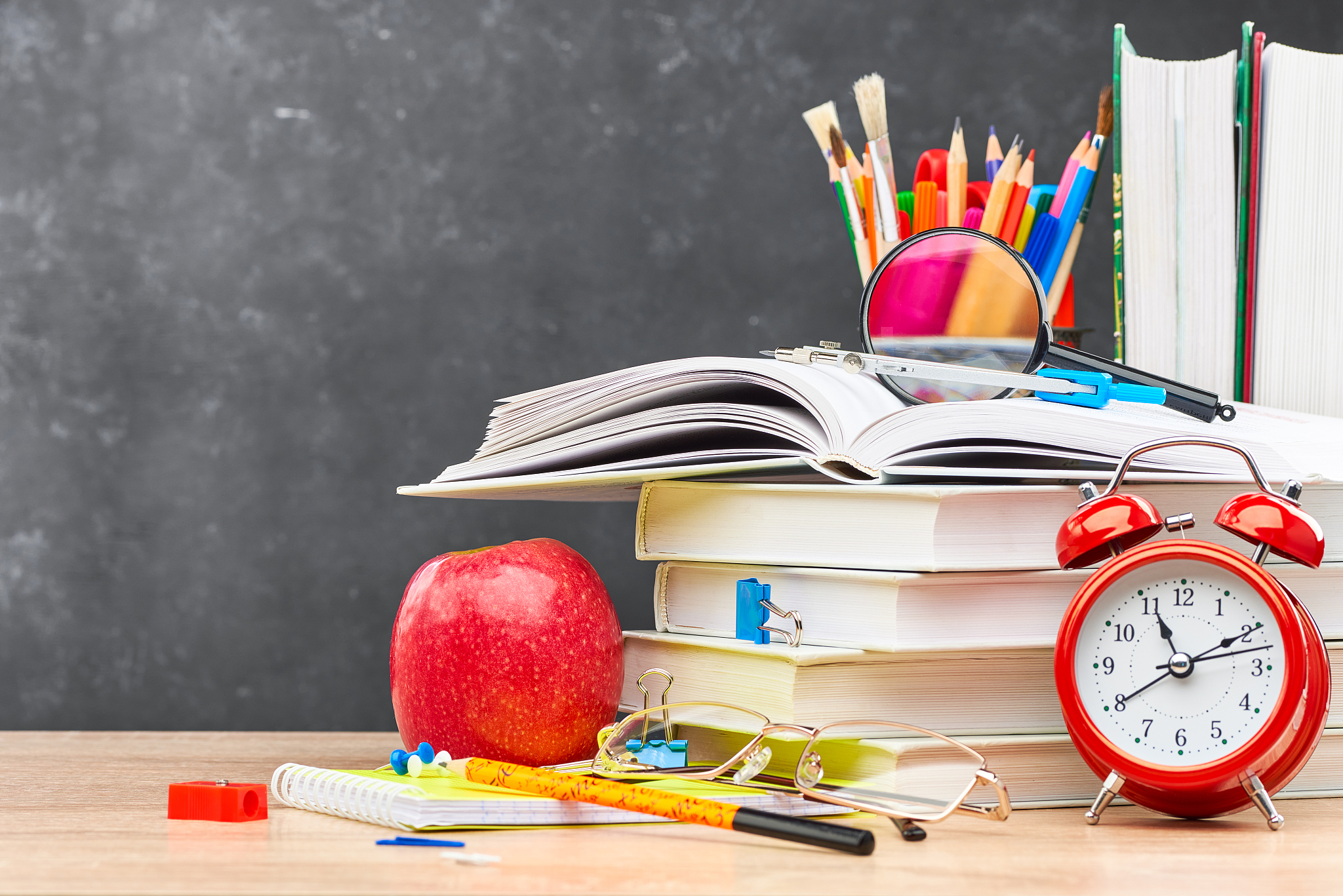 school supplies on a blackboard background