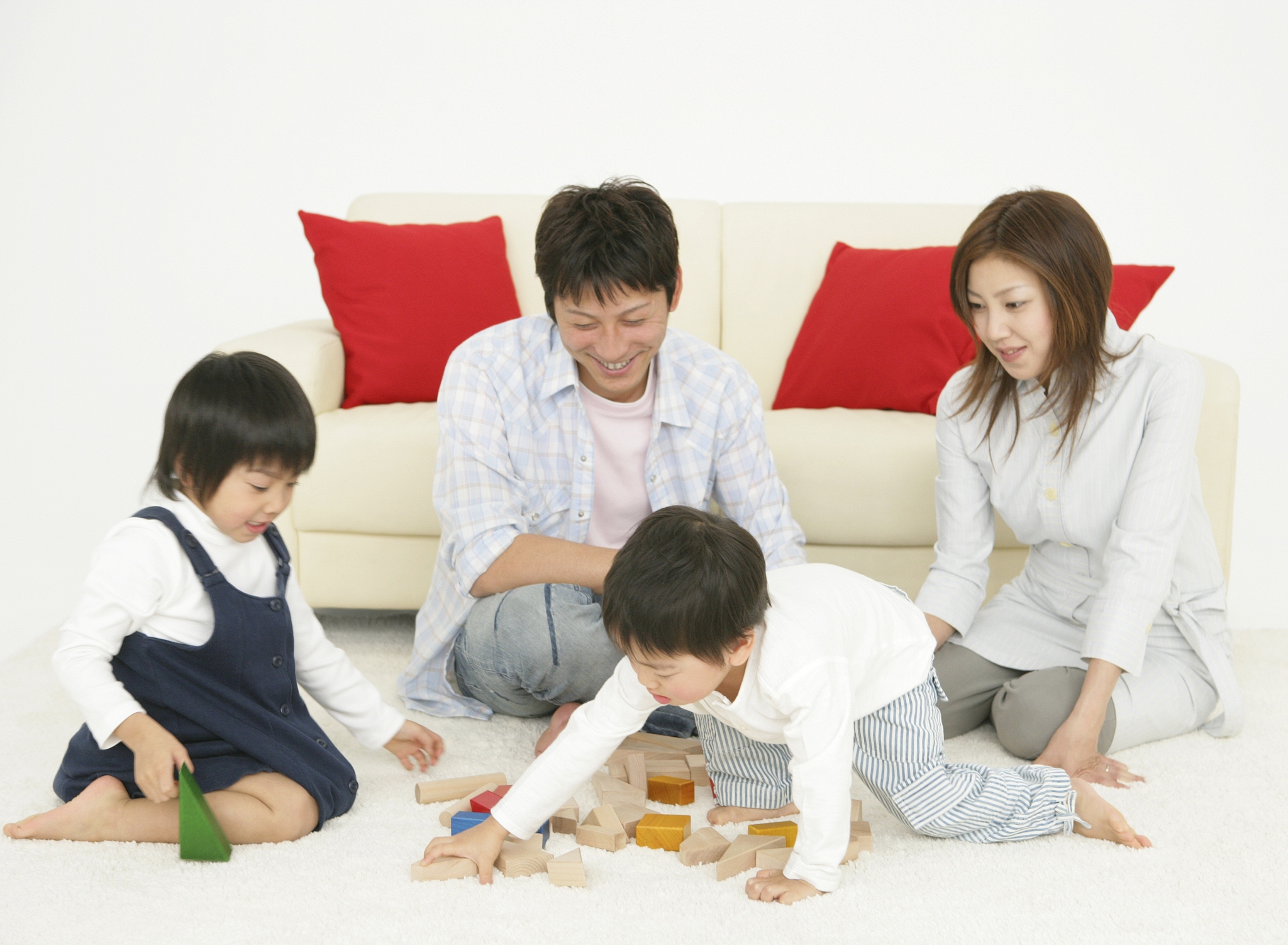 japanese couple and children playing blocks