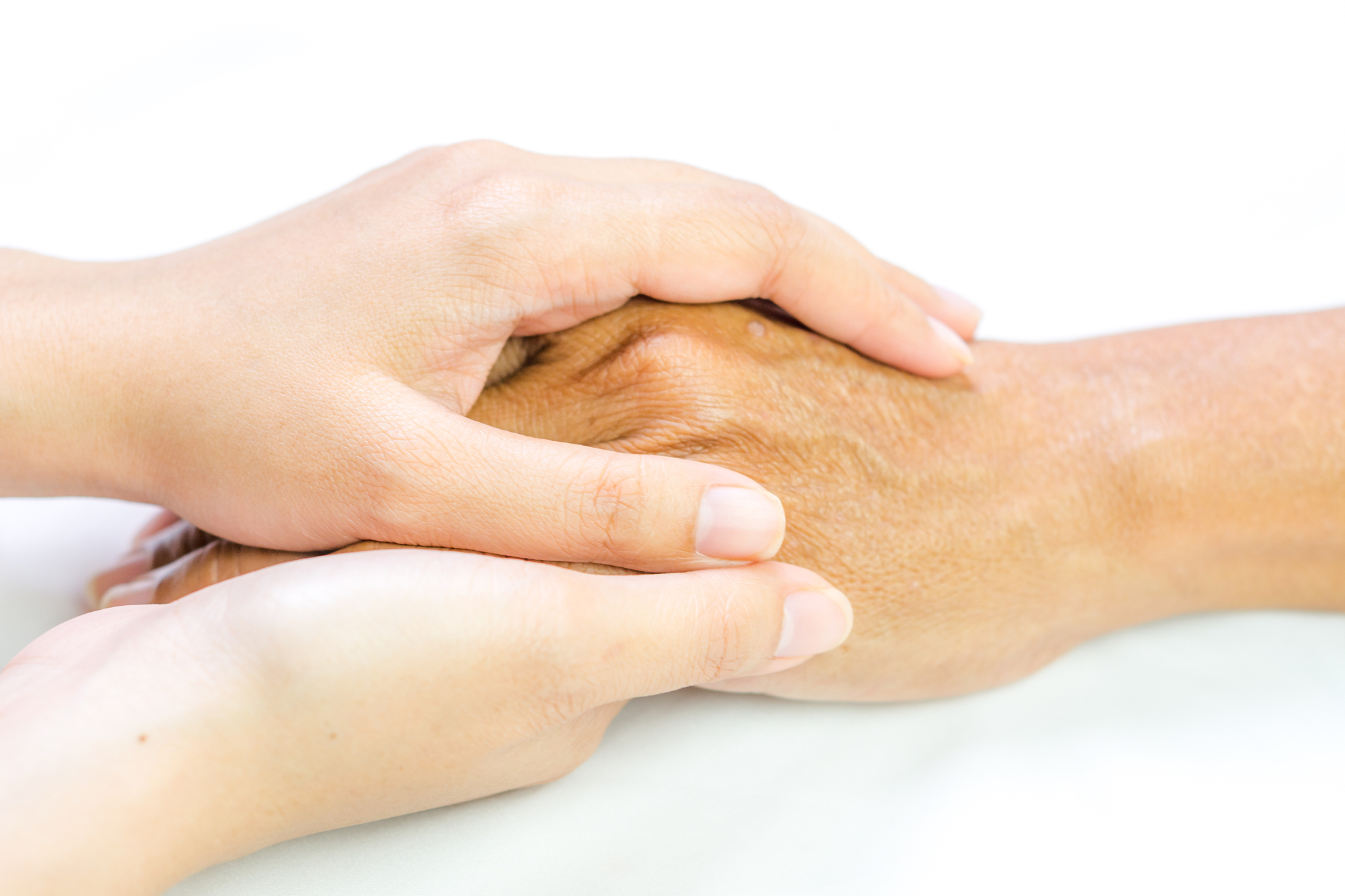 asian senior and asian young holding hands.