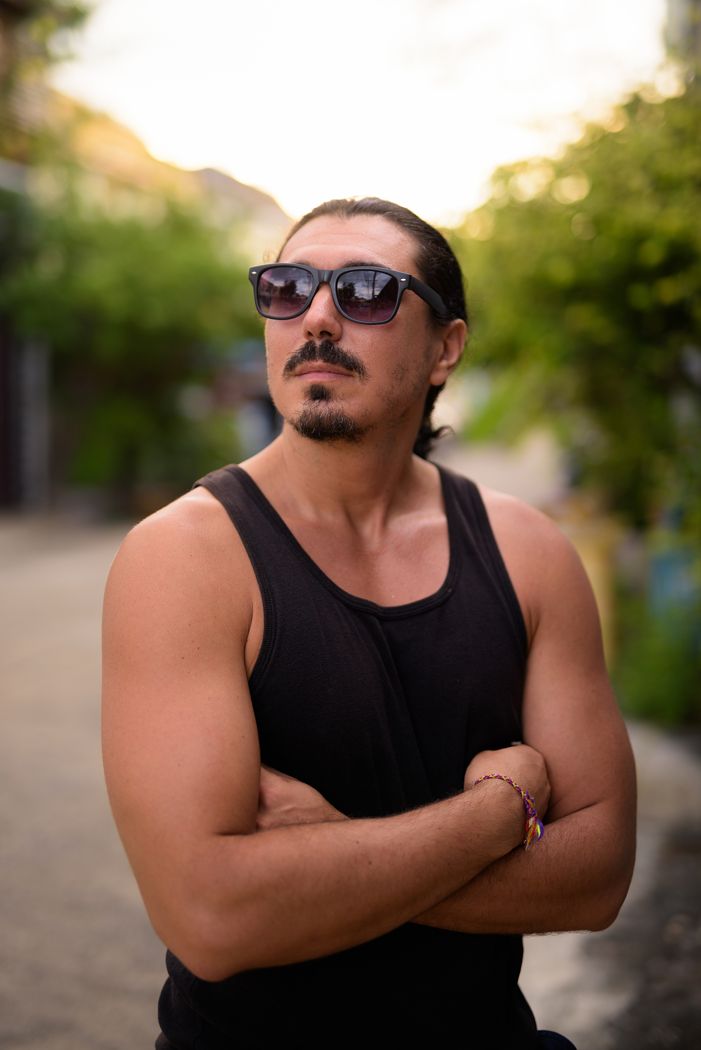 handsome muscular bearded man with long hair relaxing in the str