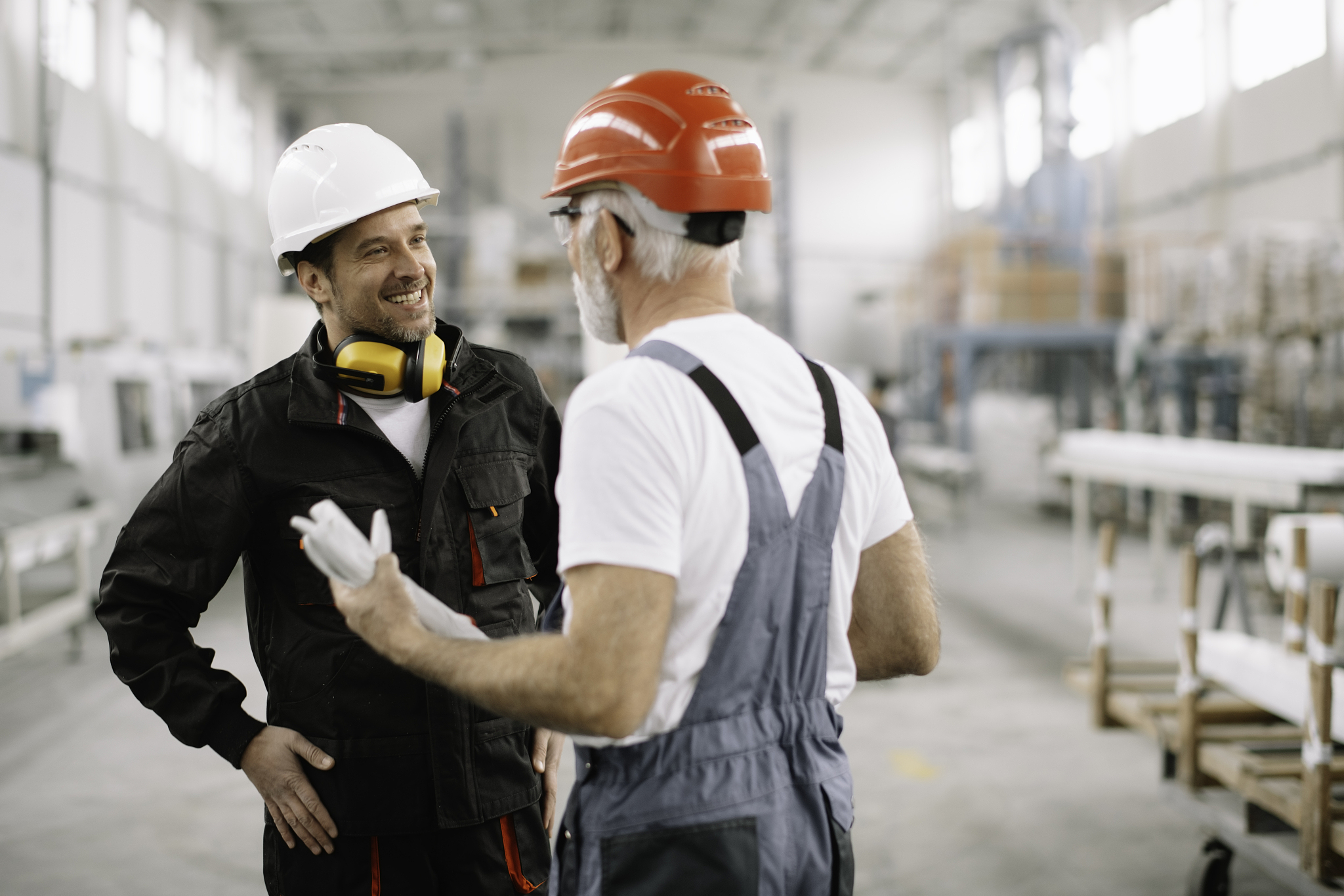 colleagues working together in factory.