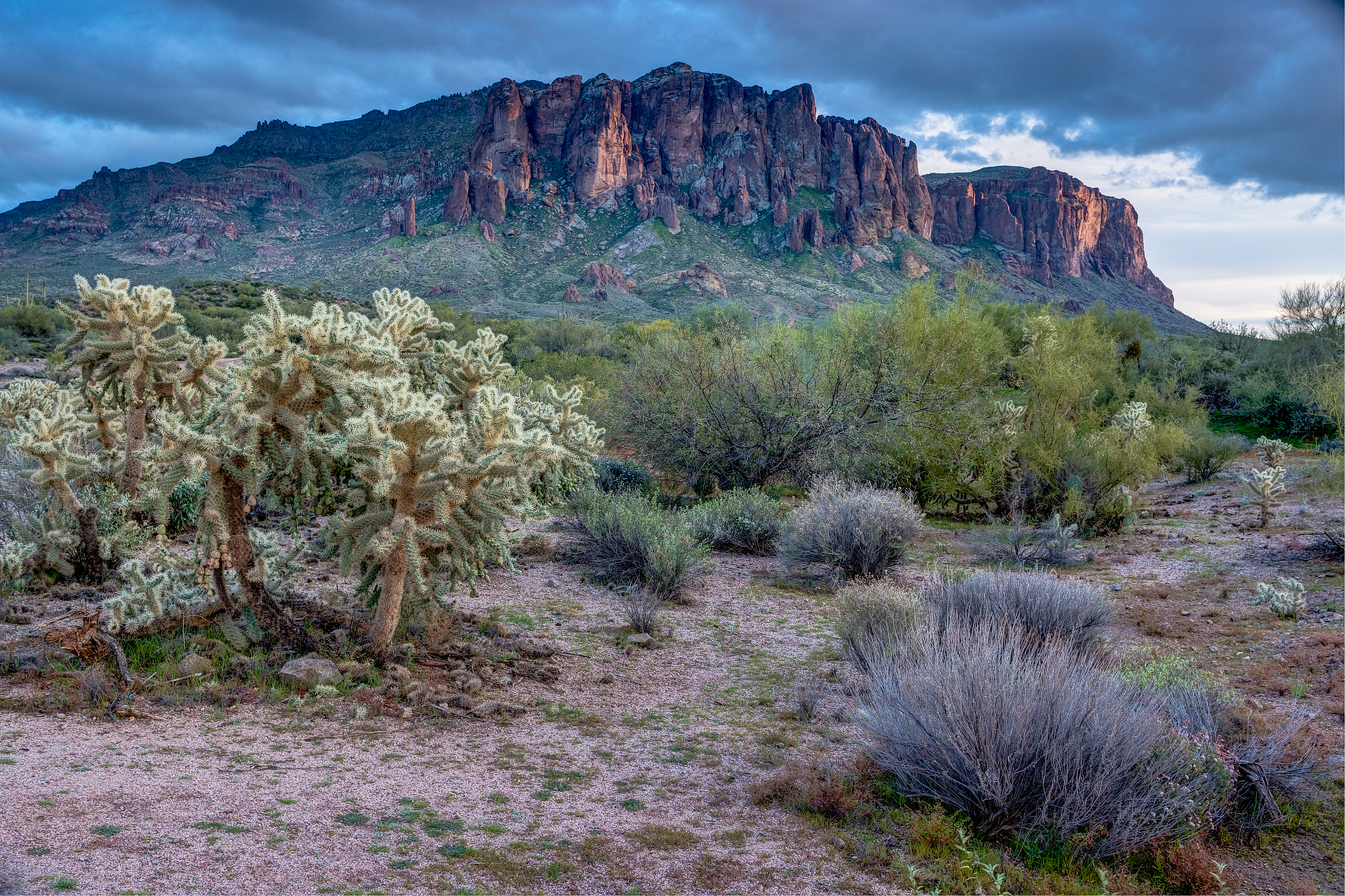 sun sets on the superstition mountains