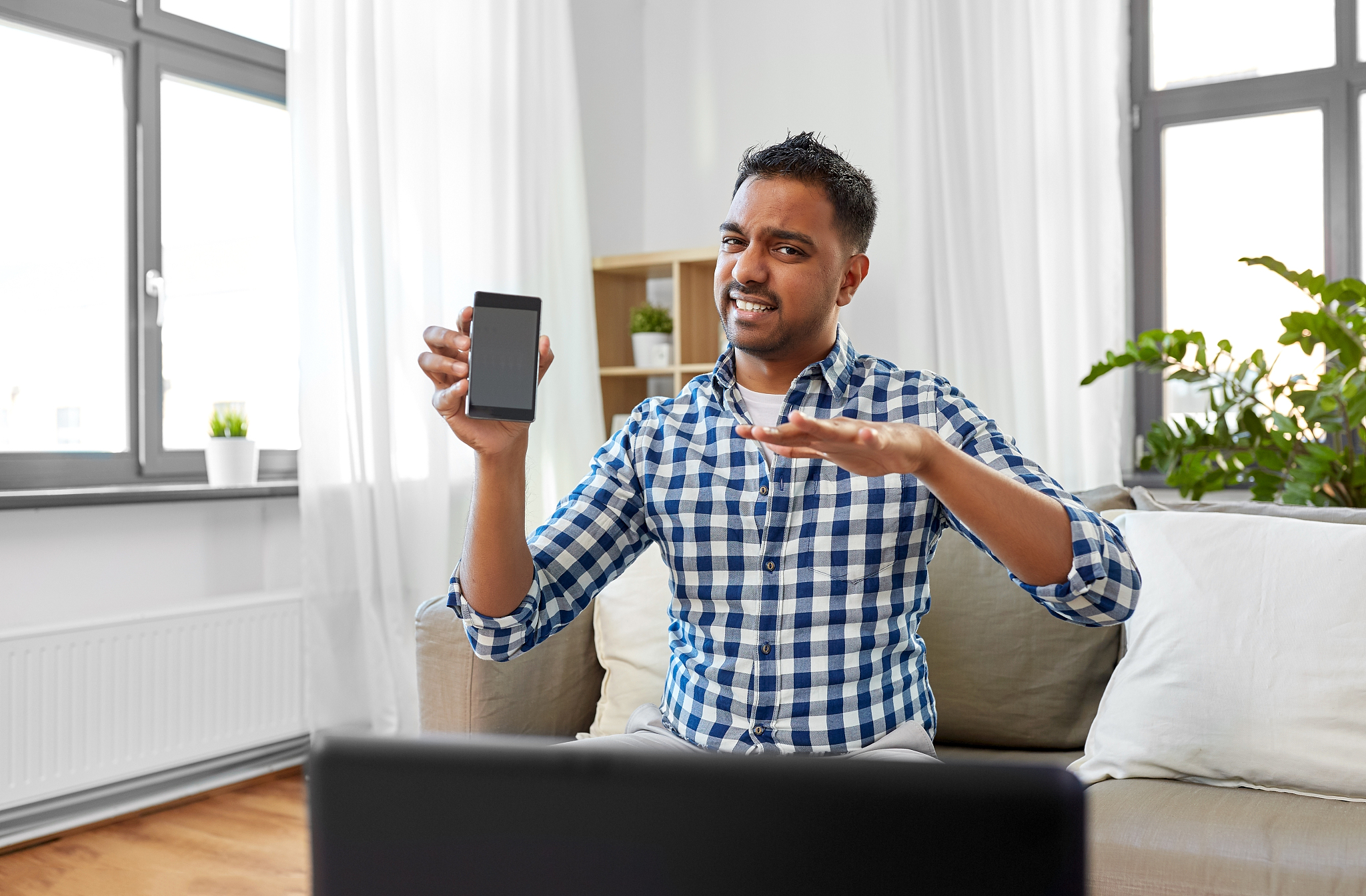 blogging, videoblog and people concept - displeased indian male 