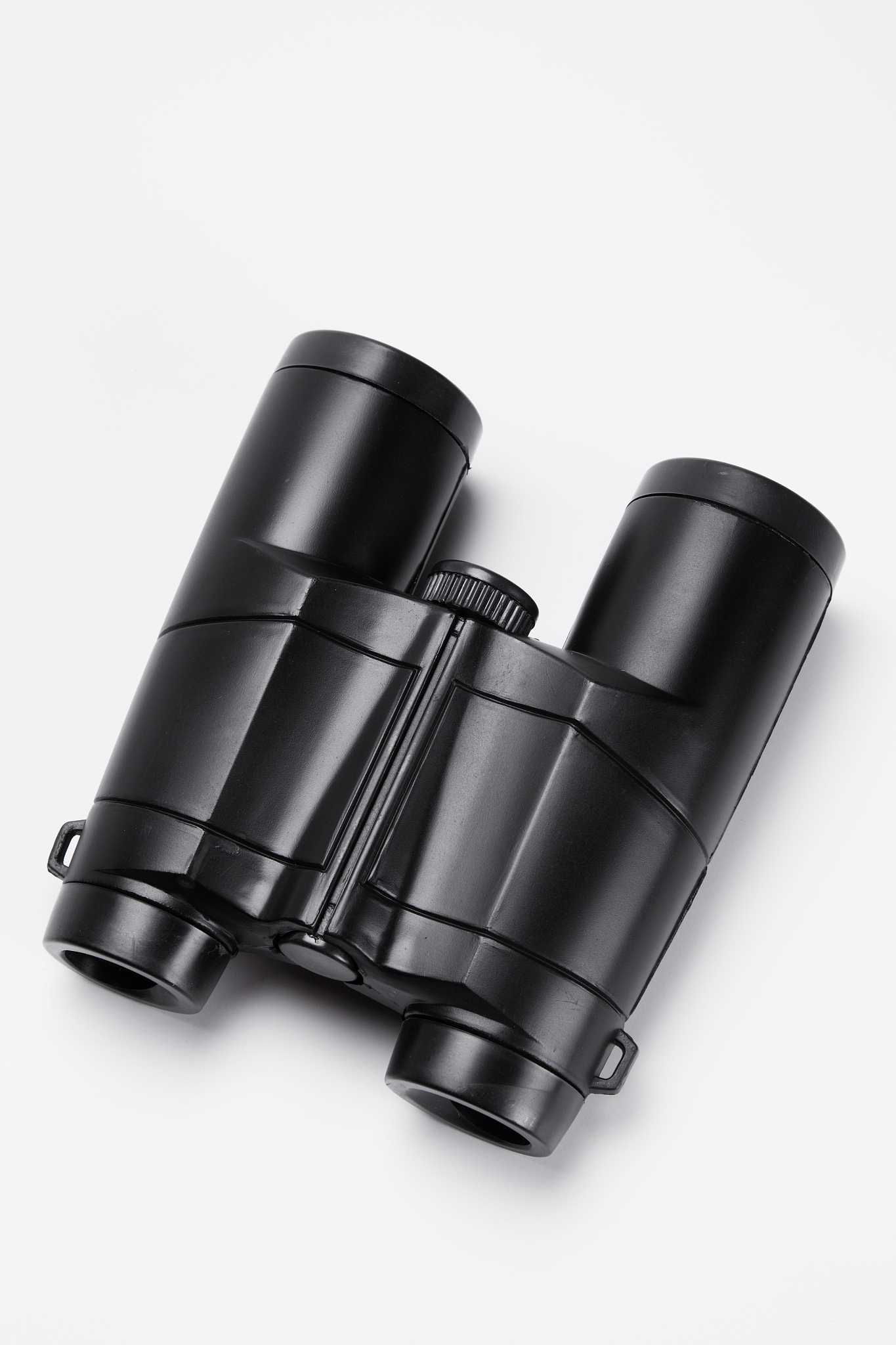 close-up of binoculars over white background