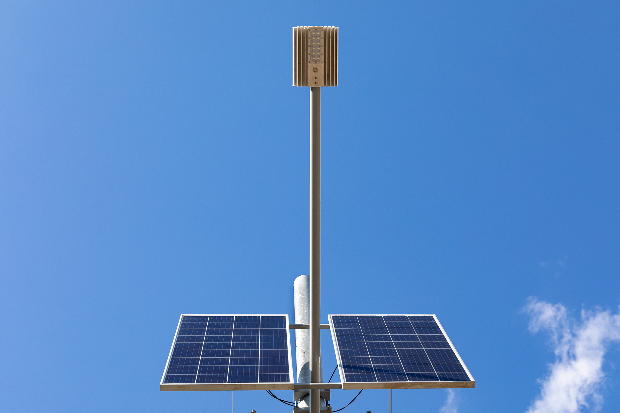 solar panel system with street light lamp post led and blue sky 