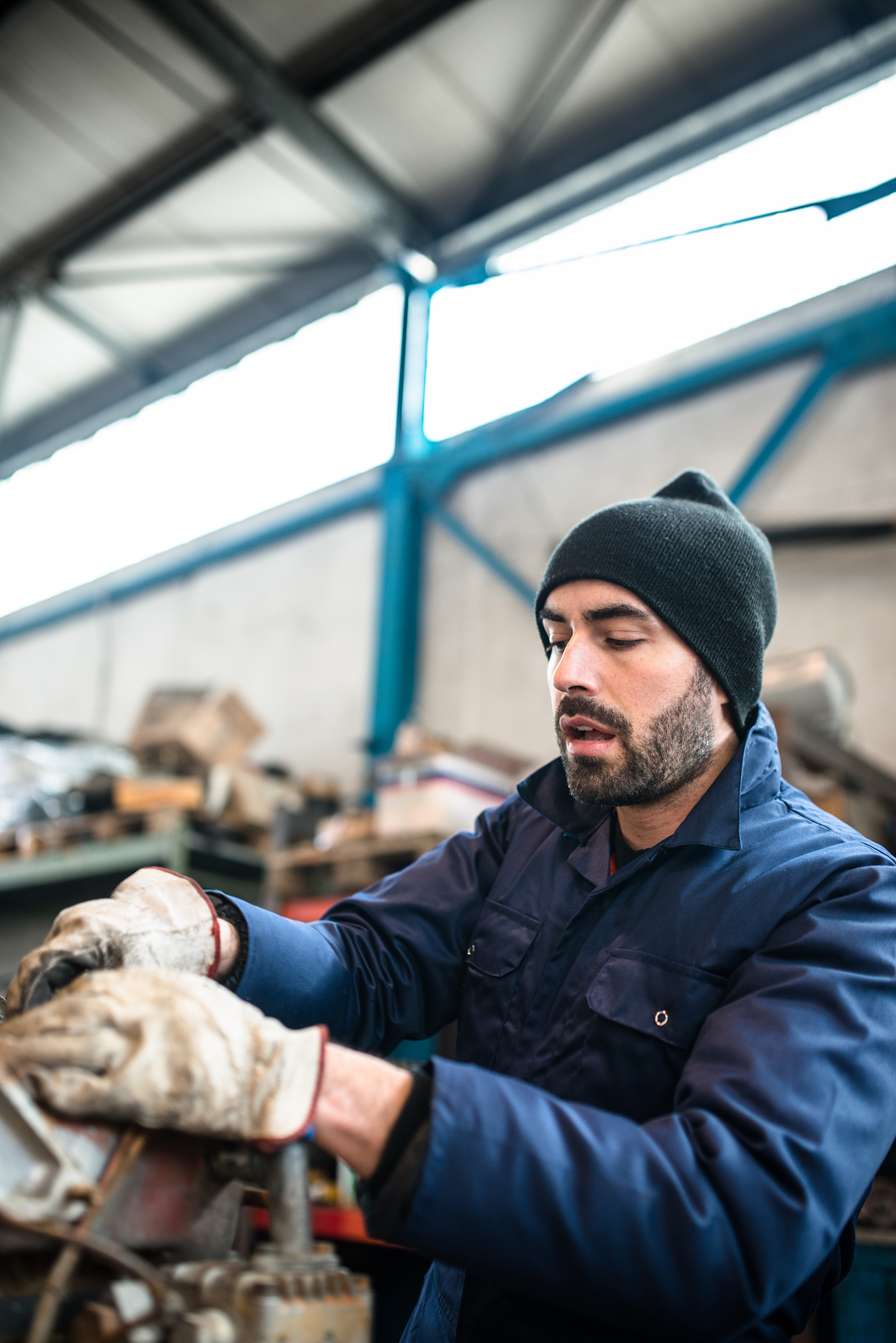 mechanic working in a workshop on a truck engine