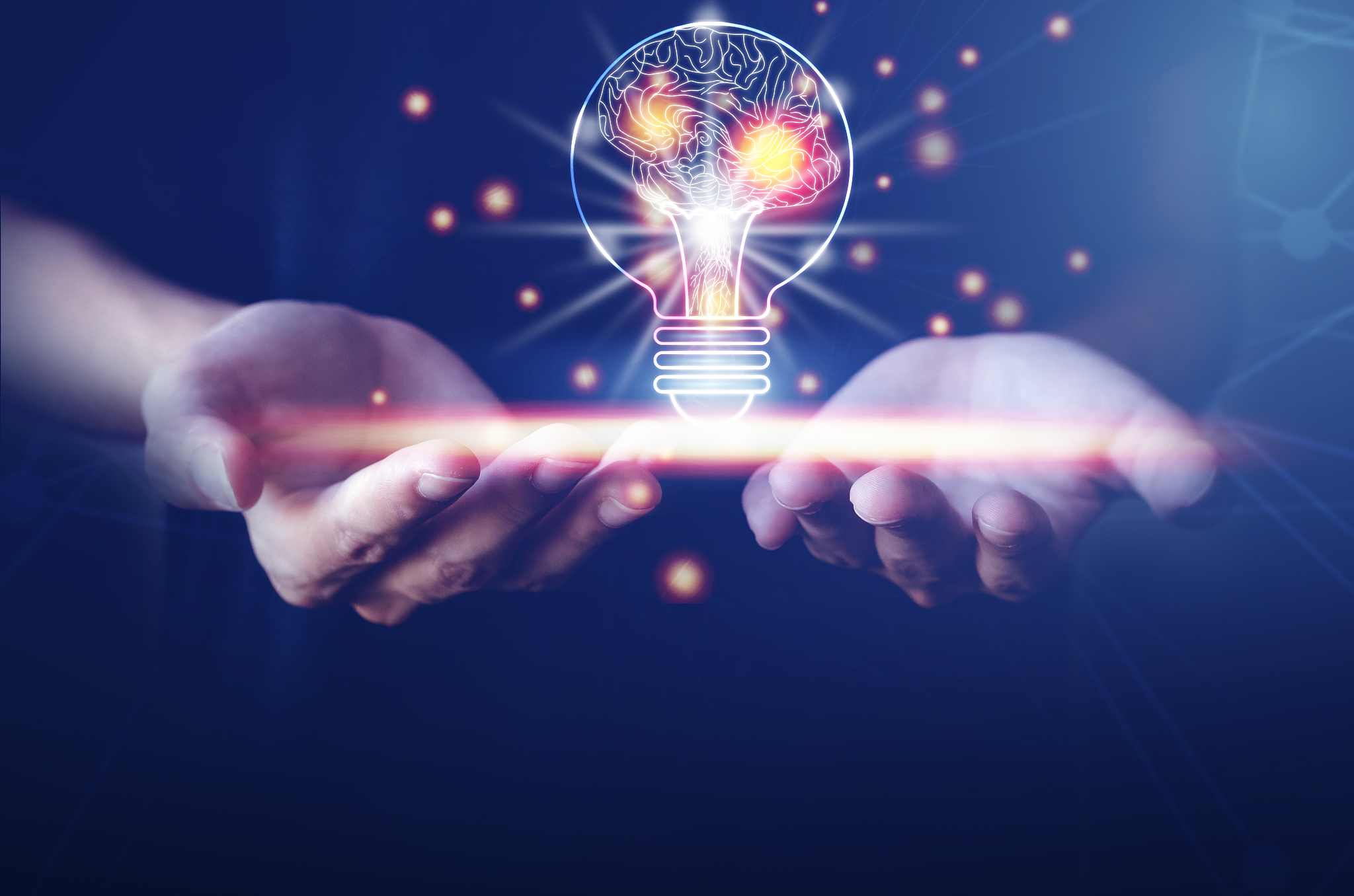 light bulb with brain inside the hands of the businessman and po
