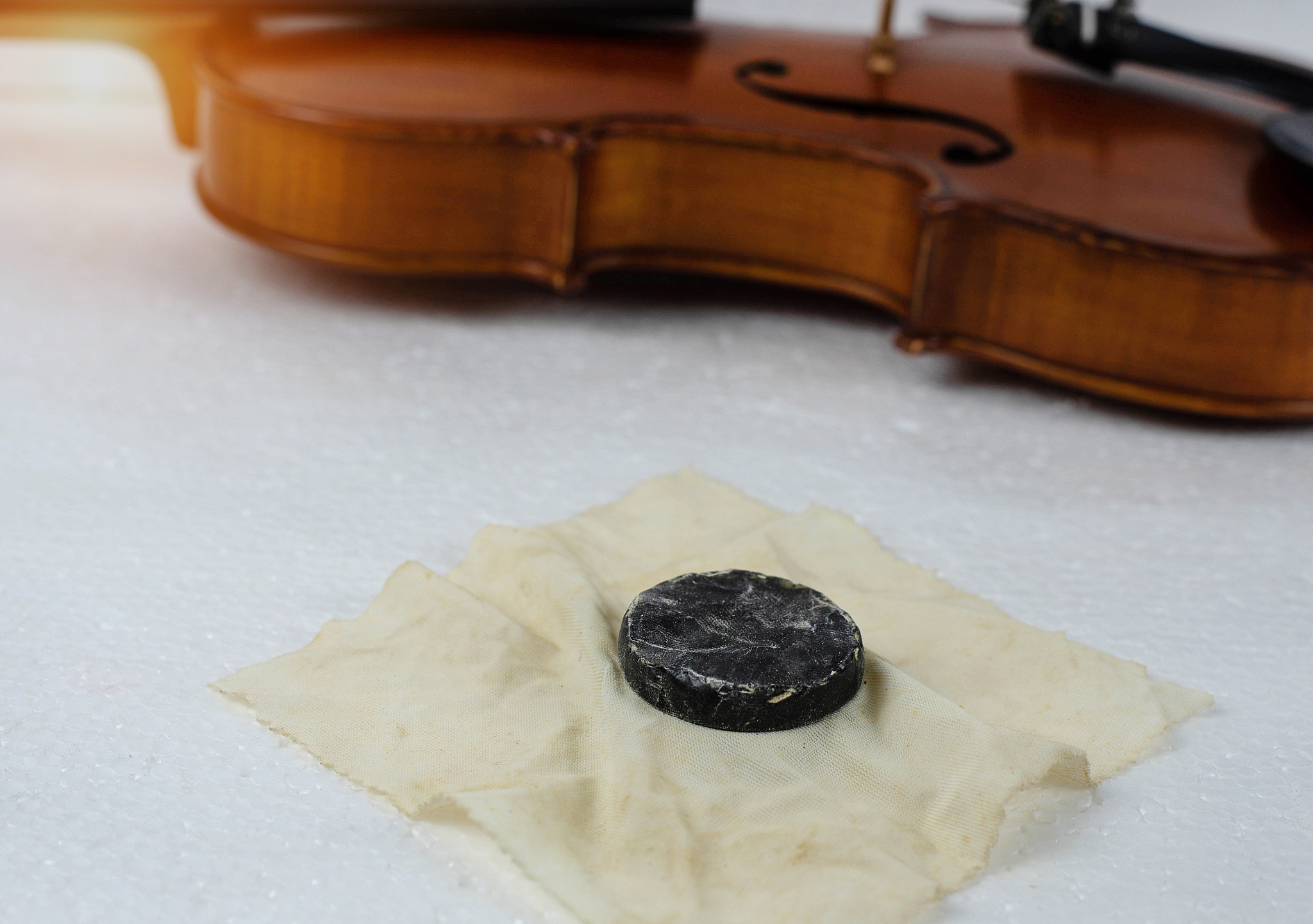 in selective focus of used rosin for violin,put on background,bl